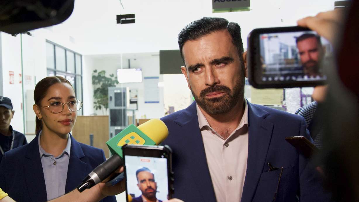 Alejandra Payan, left, and Ruben Benitez, right, lawyers for boxer Julio César Chávez Jr., speak to the press after the hearing to determine his legal status in Hermosillo, Mexico, Saturday, Aug. 23, 2025.