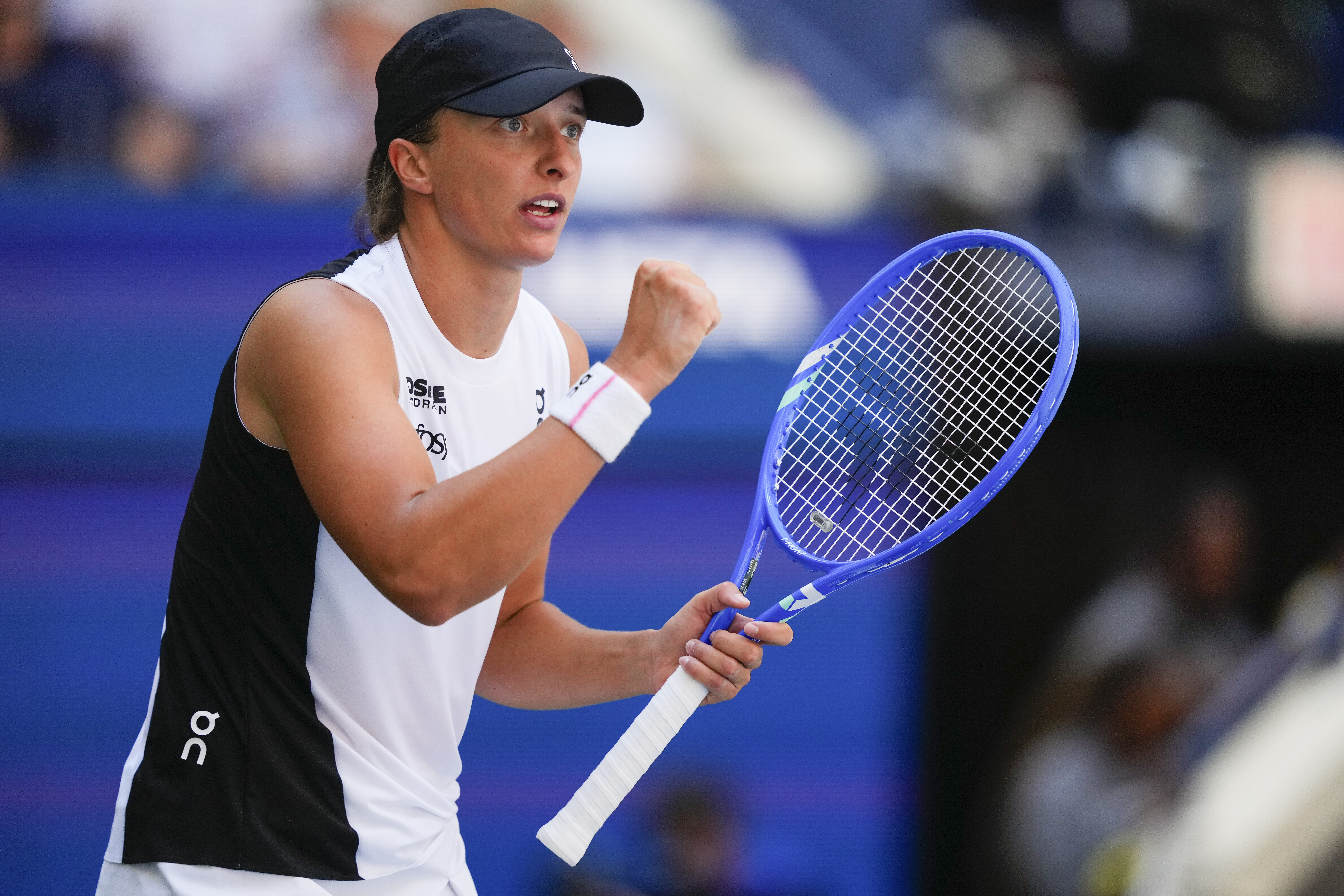 Iga Swiatek, of Poland, reacts after scoring a point against Emiliana Arango, of Colombia, during the first round of the US Open tennis championships, Tuesday, Aug. 26, 2025, in New York. 