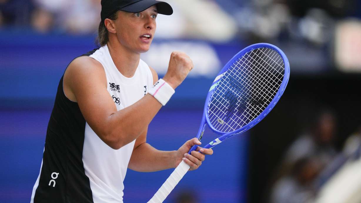 Iga Swiatek, of Poland, reacts after scoring a point against Emiliana Arango, of Colombia, during the first round of the US Open tennis championships, Tuesday, Aug. 26, 2025, in New York.