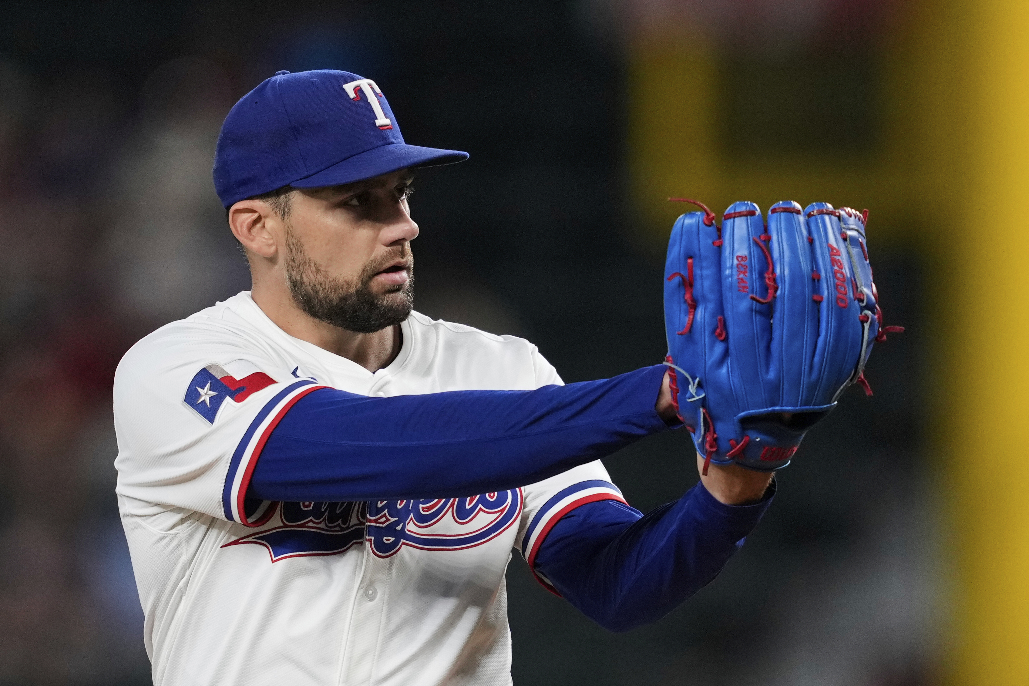 Texas Rangers starting pitcher Nathan Eovaldi prepares to deliver to the Arizona Diamondbacks in the first inning of a baseball game Monday, Aug. 11, 2025, in Arlington, Texas. 