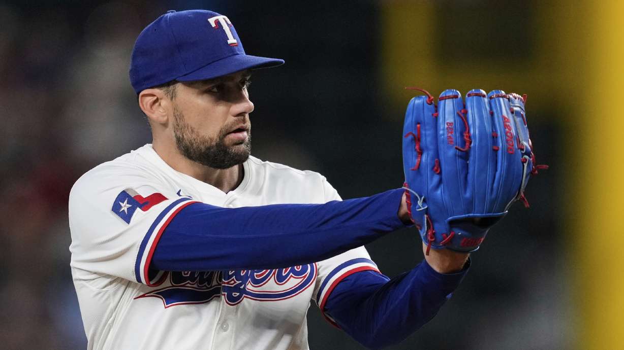 Texas Rangers starting pitcher Nathan Eovaldi prepares to deliver to the Arizona Diamondbacks in the first inning of a baseball game Monday, Aug. 11, 2025, in Arlington, Texas.