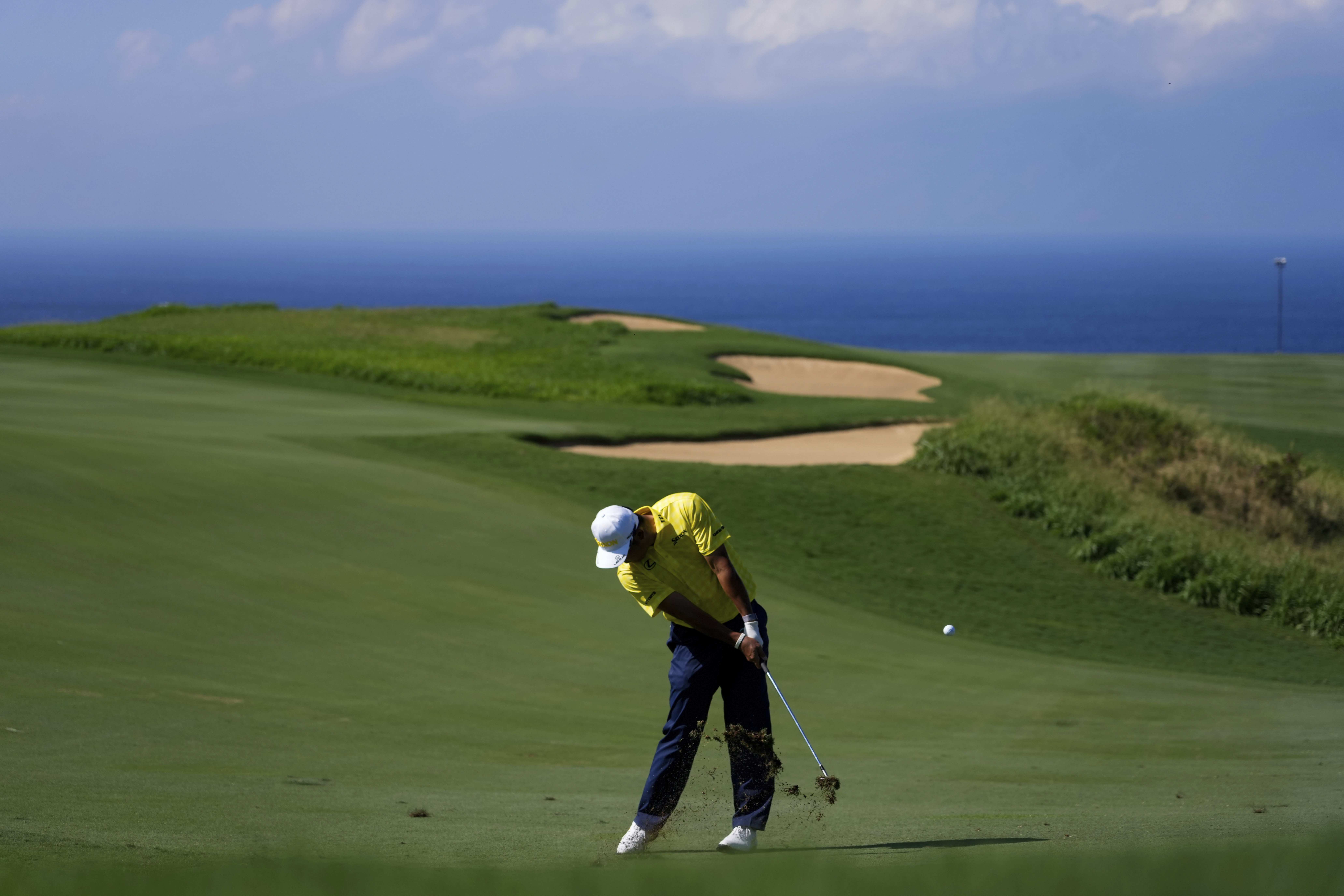 FILE - Hideki Matsuyama, of Japan, hits on the 13th hole during the final round of The Sentry golf event, Jan. 5, 2025, at Kapalua Plantation Course in Kapalua, Hawaii. 