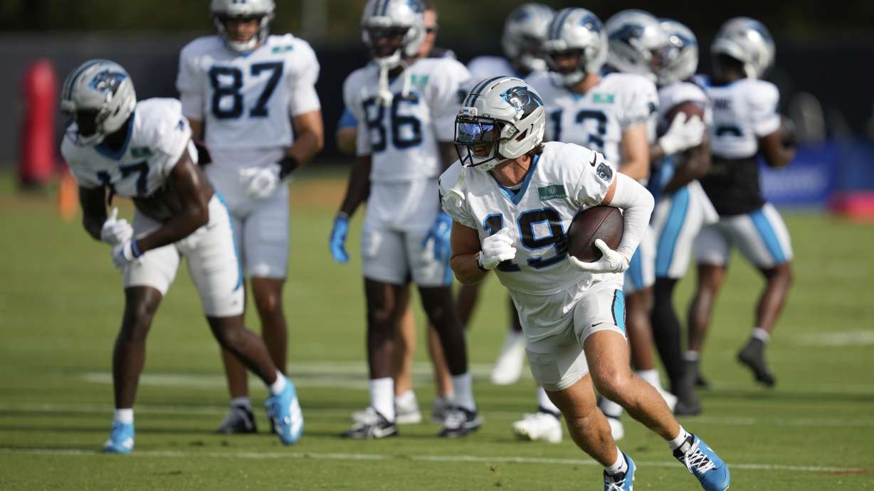 Carolina Panthers wide receiver Adam Thielen (19) runs the ball during a joint NFL football practice with the Houston Texans Thursday, Aug. 14, 2025, in Houston.