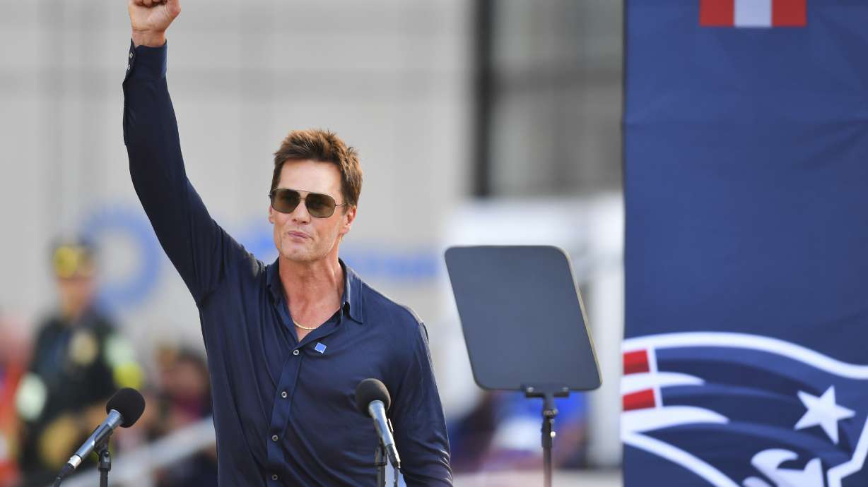 Former New England Patriots quarterback Tom Brady speaks after a bronze statue of himself was unveiled in Patriot Place Plaza before an NFL preseason football game between the Washington Commanders and the New England Patriots Friday, Aug. 8, 2025, in Foxborough, Mass.