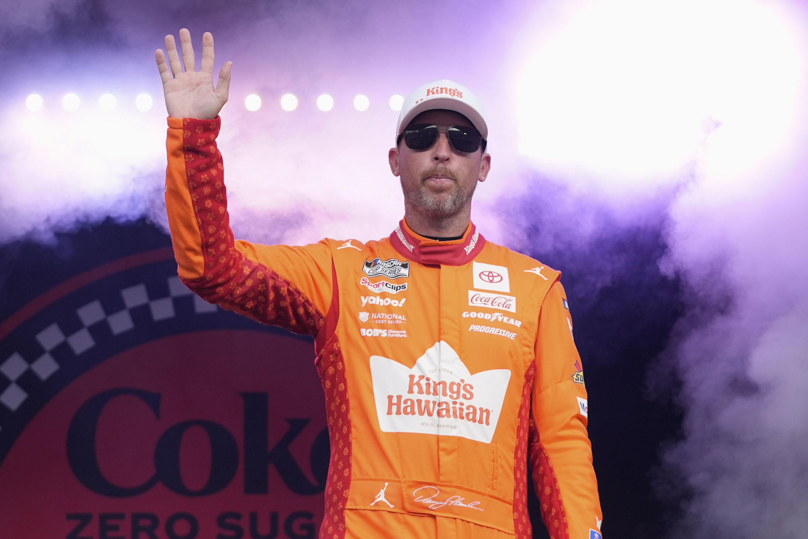 Denny Hamlin waves to fans during driver introductions before the NASCAR Cup Series auto race at Daytona International Speedway, Aug. 23, 2025, in Daytona Beach, Fla. 