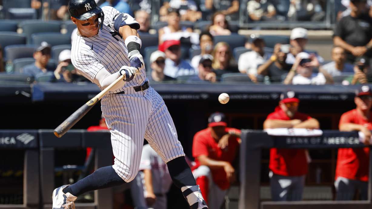 New York Yankees' Aaron Judge hits a two-run home run during the third inning of a baseball game against the Washington Nationals, Wednesday, Aug. 27, 2025, in New York.