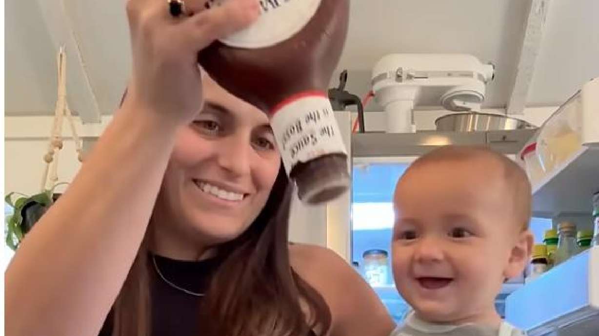 A 9-month-old baby enjoys the sounds of Sweet Baby Ray's barbecue sauce in this July 23 video.