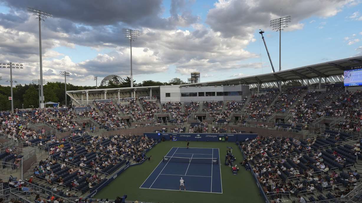 Alex de Minaur, of Australia, top in black, serves to Christopher O'Connell, of Australia, during the first round of the U.S. Open tennis championships, Tuesday, Aug. 26, 2025, in New York.