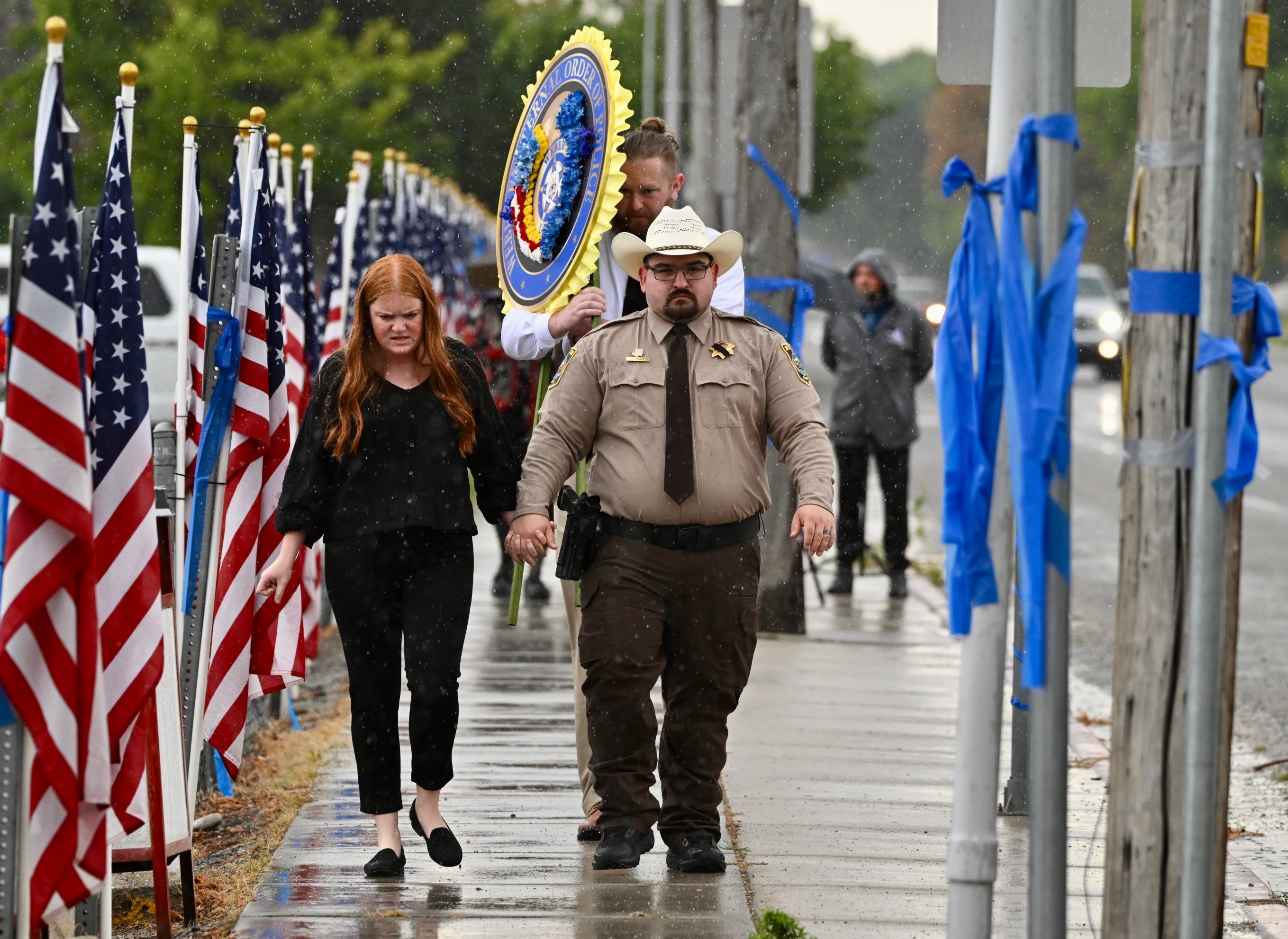 Representatives from the Unified Police Department arrive for the viewing of both Tremont-Garland officers at Bear River High School in Garland, Box Elder County, on Wednesday.