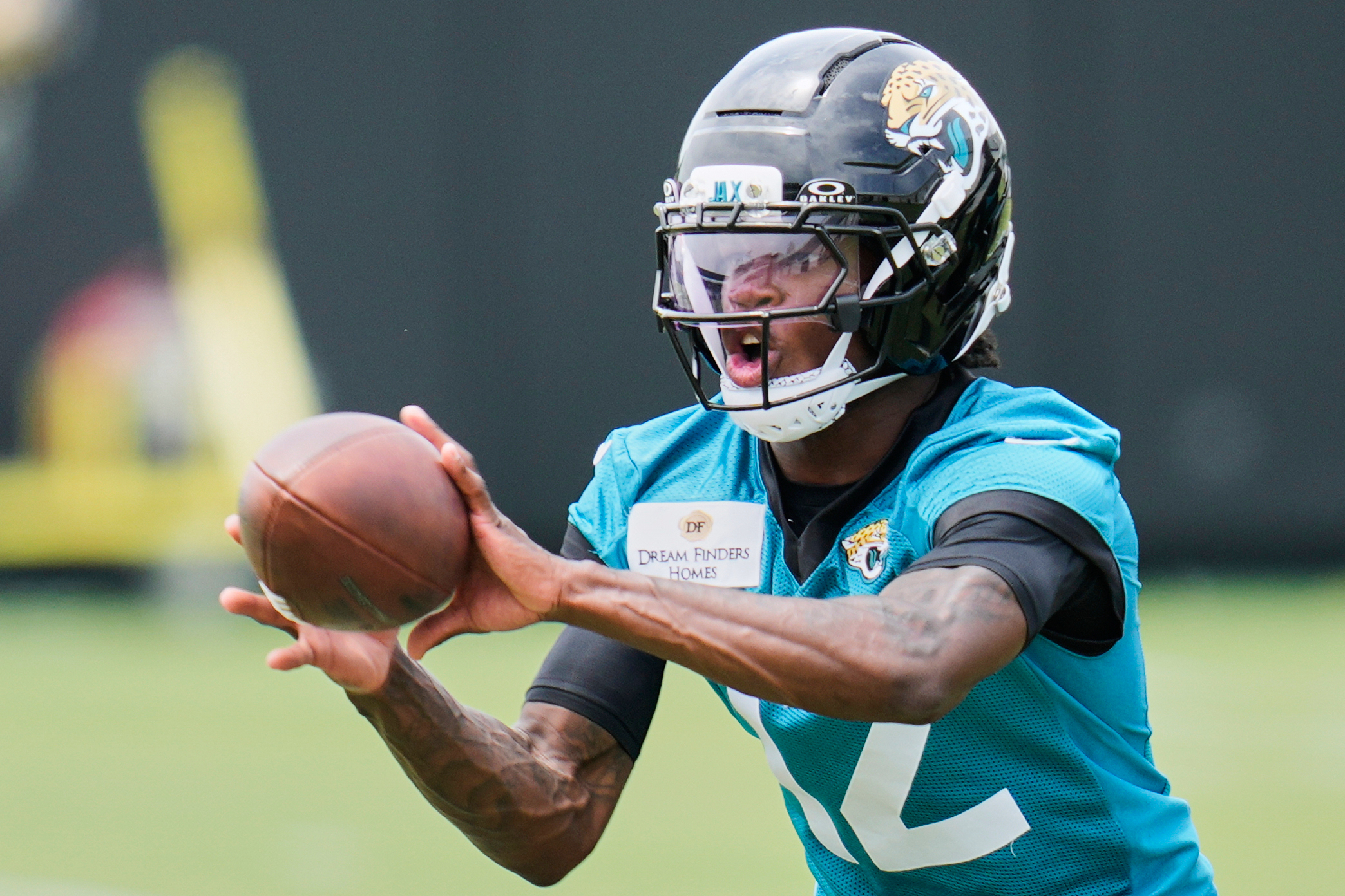 FILE - Jacksonville Jaguars wide receiver Travis Hunter makes a reception during the NFL football team's rookie minicamp, Saturday, May 10, 2025, in Jacksonville, Fla. 