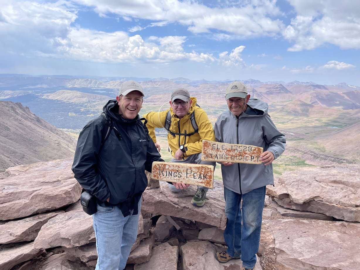 Carson Stanford, left, Kent Stanford, center, and Brandon Stanford stand atop Kings Peak on July 31. Kent Stanford had a goal to hike the tallest peaks in each county in Utah.