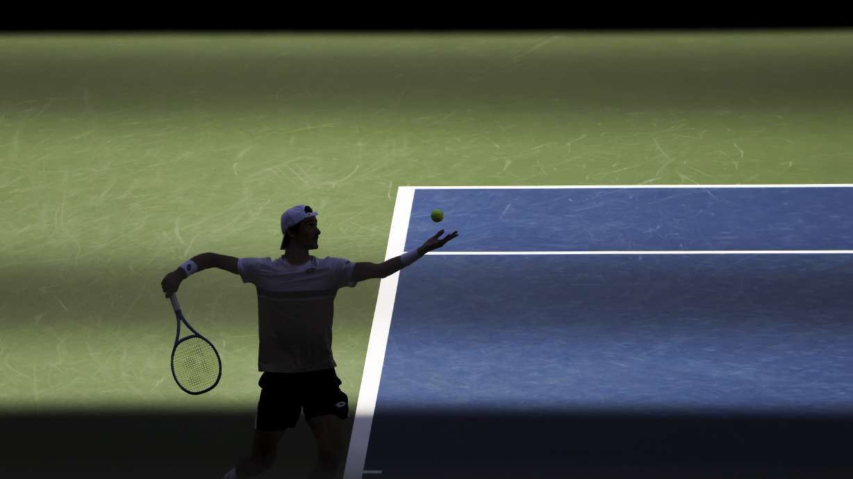 Lloyd Harris, of South Africa, serves to Taylor Fritz, of the United States, during the second round of the U.S. Open tennis championships, Wednesday, Aug. 27, 2025, in New York.