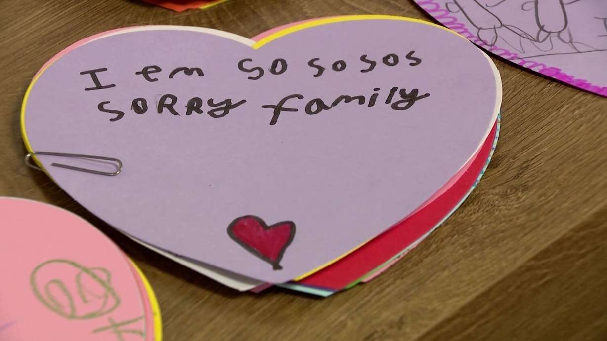 Students at Ranches Academy in Eagle Mountain wrote messages showing their support for a family displaced by a condominium complex fire. The family was due to have a baby next week.