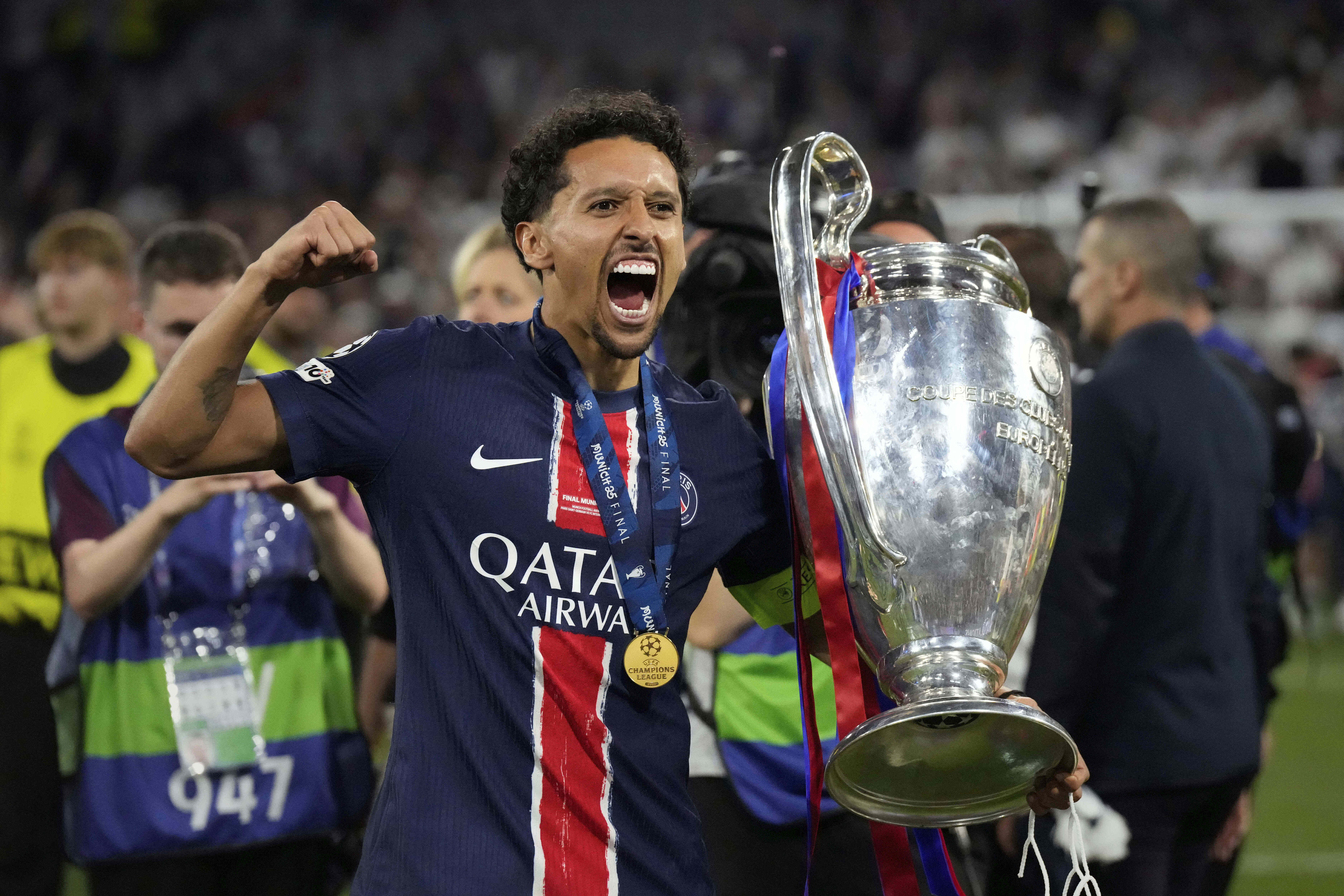 FILE - PSG's Marquinhos poses with the trophy after the Champions League final soccer match between Paris Saint-Germain and Inter Milan at the Allianz Arena in Munich, Germany, May 31, 2025.