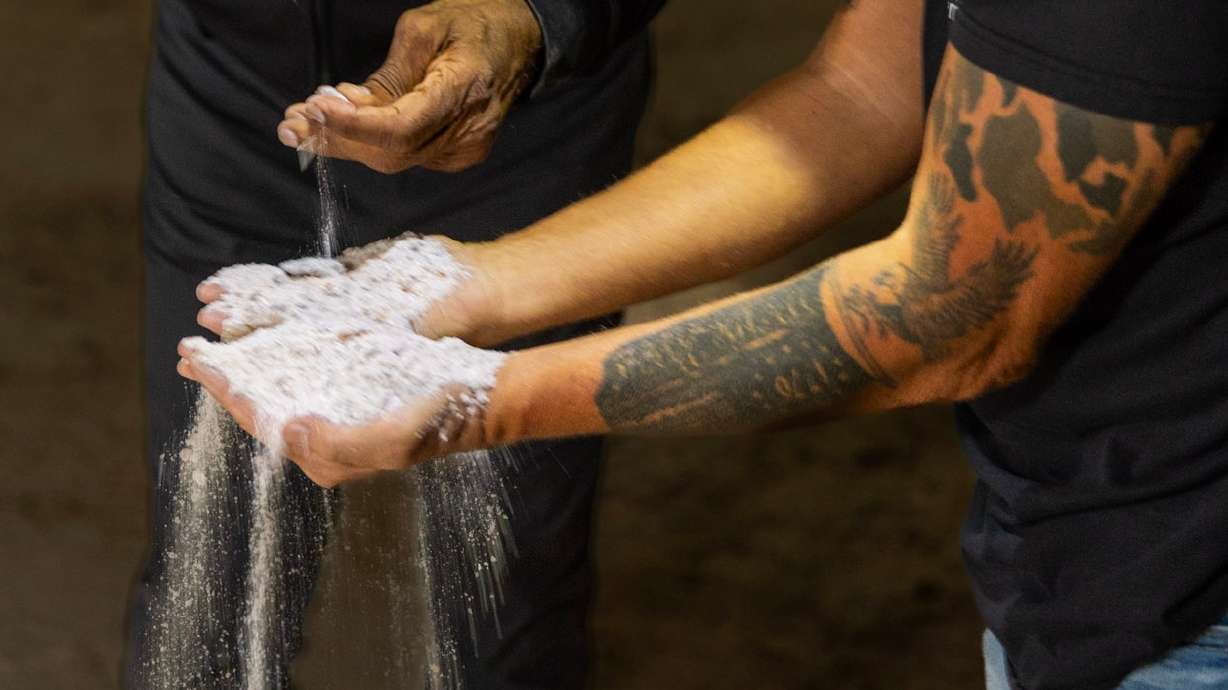 A worker tests road salt at Redmond Minerals in Redmond, Sevier County. Rep. Burgess Owens visited the company to take a look at why the domestic road salt industry, a vital component of the nation's economy, is facing a decline.