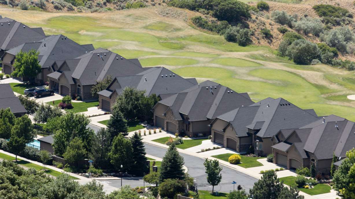 Houses in Draper on July 10. Mortgage rates headed down this week, reaching a 10-month low, but a Zions Bank mortgage manager said Thursday the best time to buy might be now.