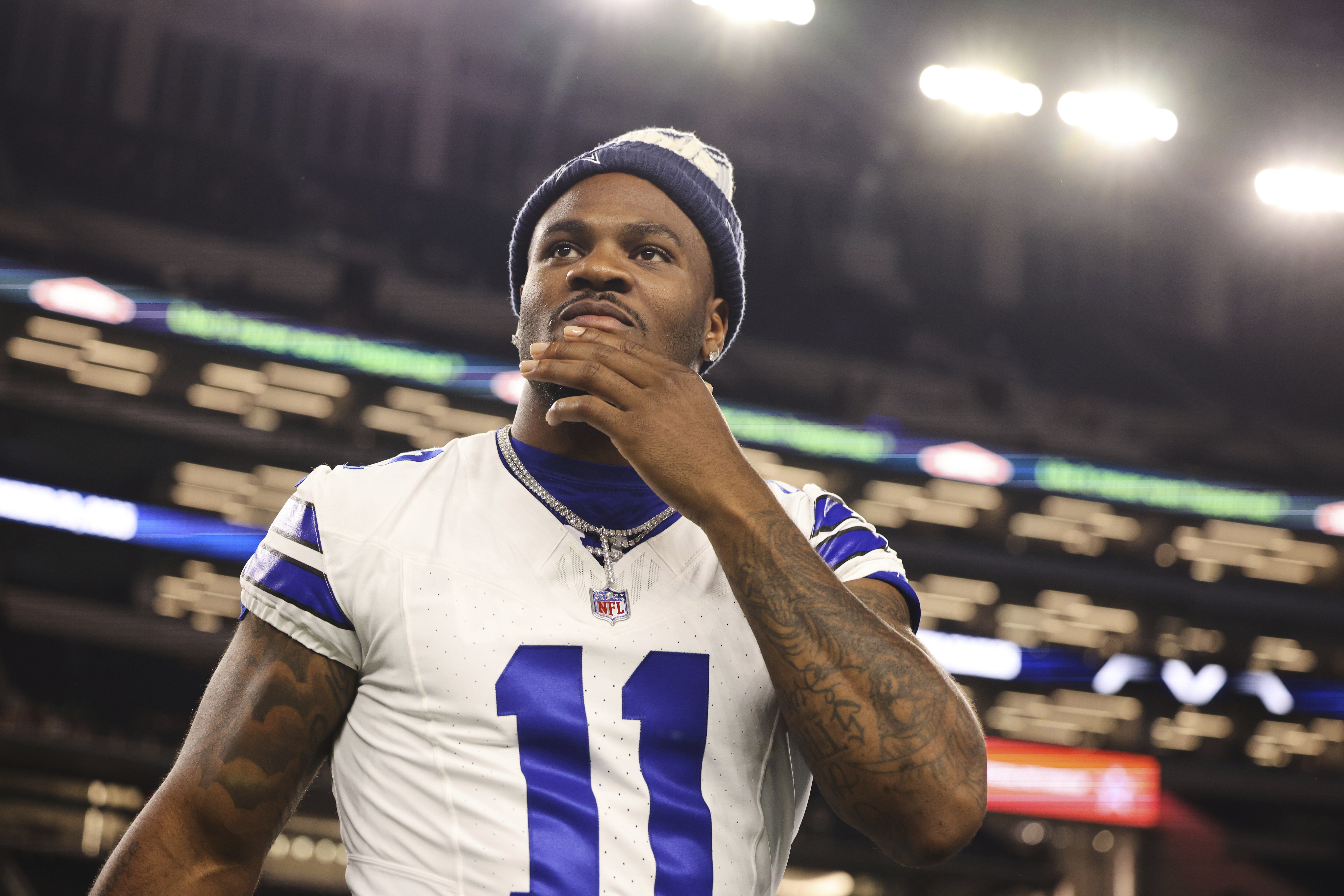 Dallas Cowboys defensive end Micah Parsons walks onto the field after the team's preseason NFL football game against the Baltimore Ravens Saturday, Aug. 16, 2025, in Arlington, Texas. 