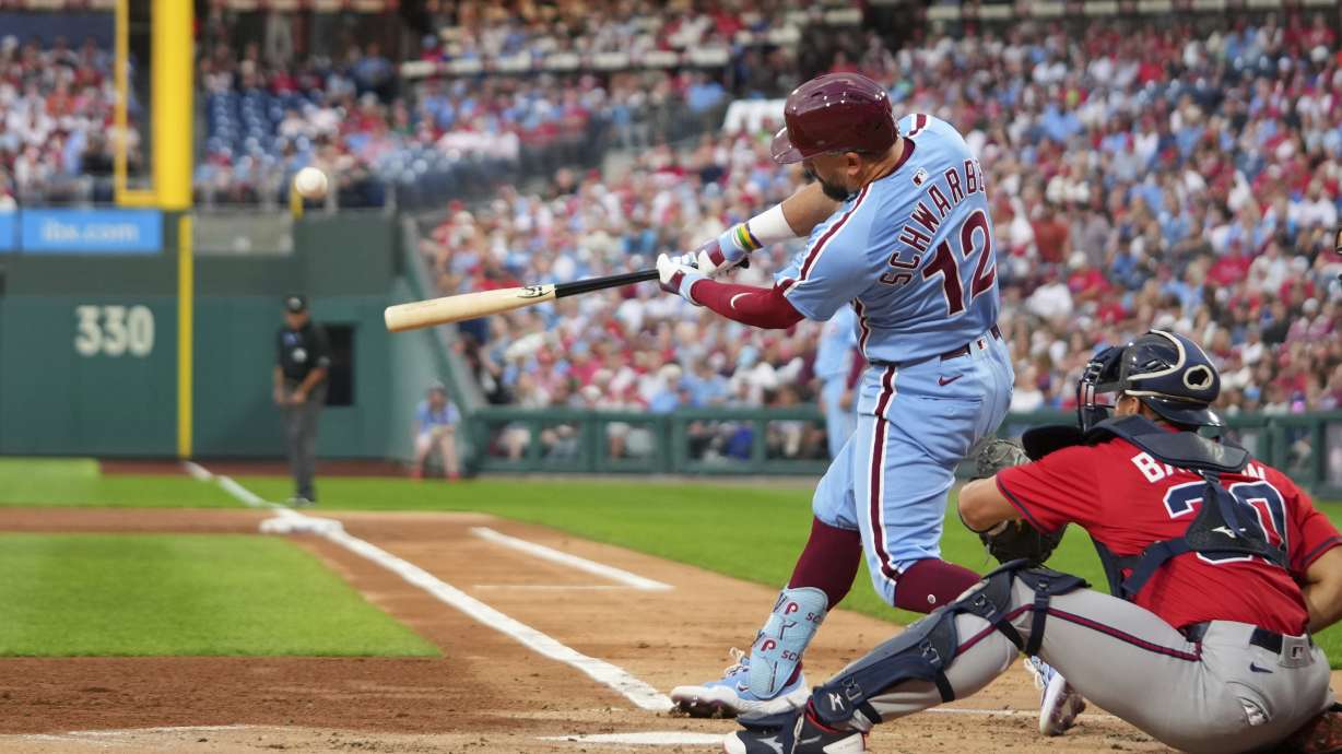 Philadelphia Phillies' Kyle Schwarber hits a home run against Atlanta Braves pitcher Cal Quantrill during the first inning of a baseball game Thursday, Aug. 28, 2025, in Philadelphia.