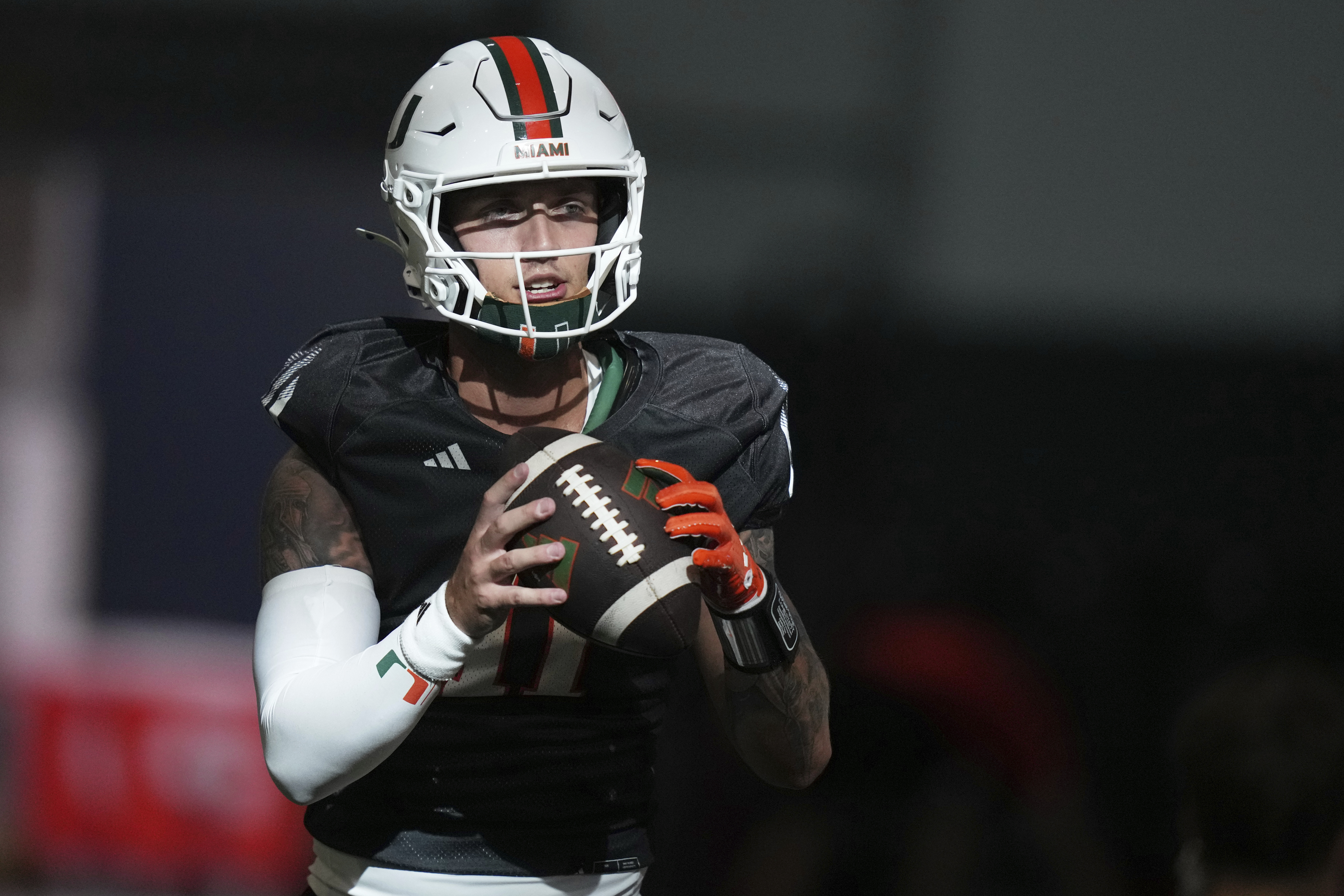 Miami quarterback Carson Beck does drills during NCAA college football practice, Monday, Aug. 4, 2025, in Coral Gables, Fla. 
