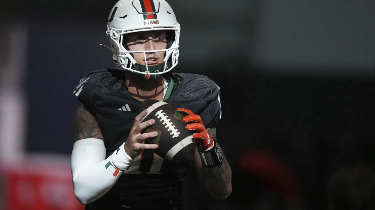Miami quarterback Carson Beck does drills during NCAA college football practice, Monday, Aug. 4, 2025, in Coral Gables, Fla.