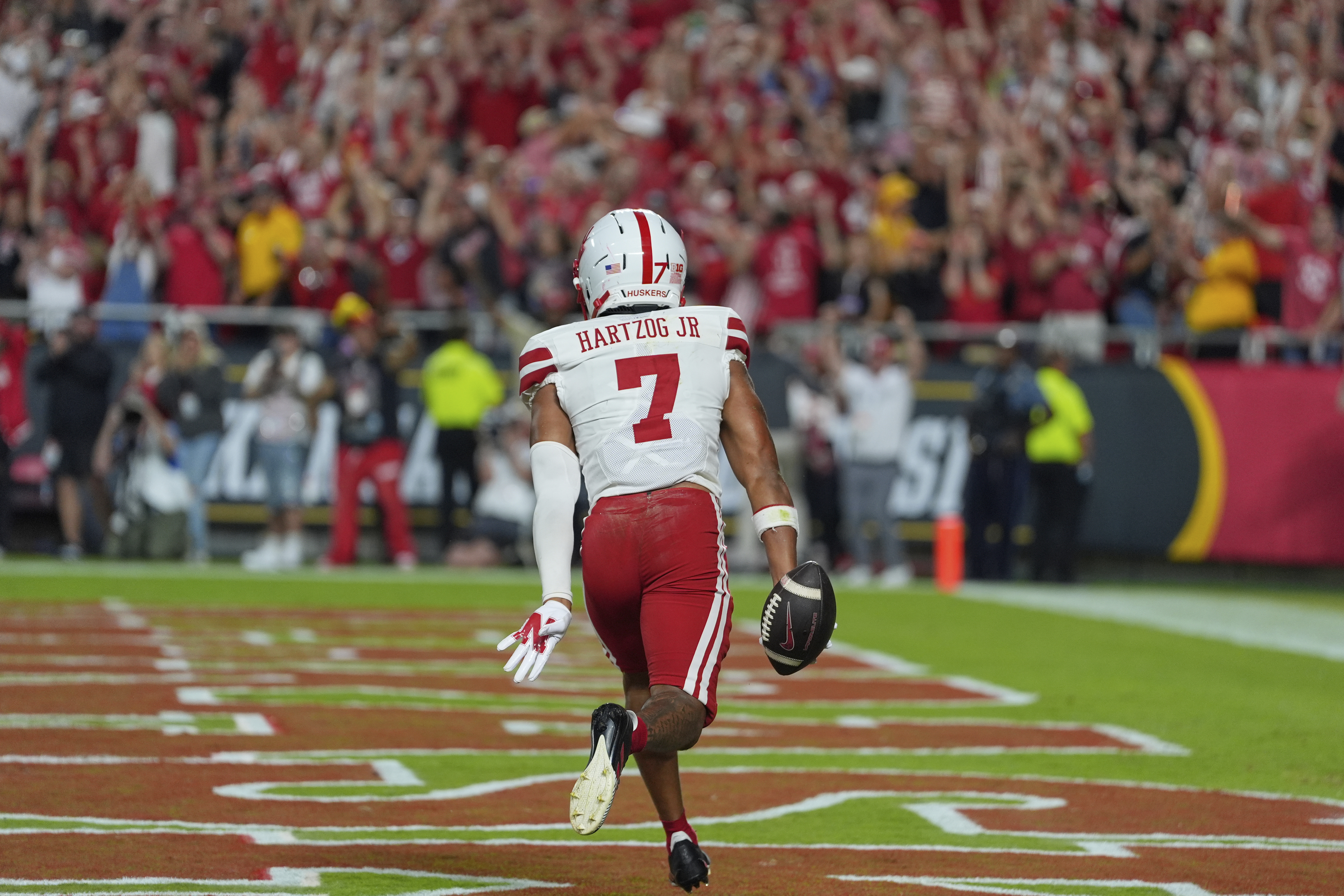 Nebraska defensive back Malcolm Hartzog Jr. (7) celebrates after intercepting a pass intended for Cincinnati wide receiver Caleb Goodie (10) during the second half of an NCAA college football game Friday, Aug. 29, 2025, at Arrowhead Stadium in Kansas City, Mo. 