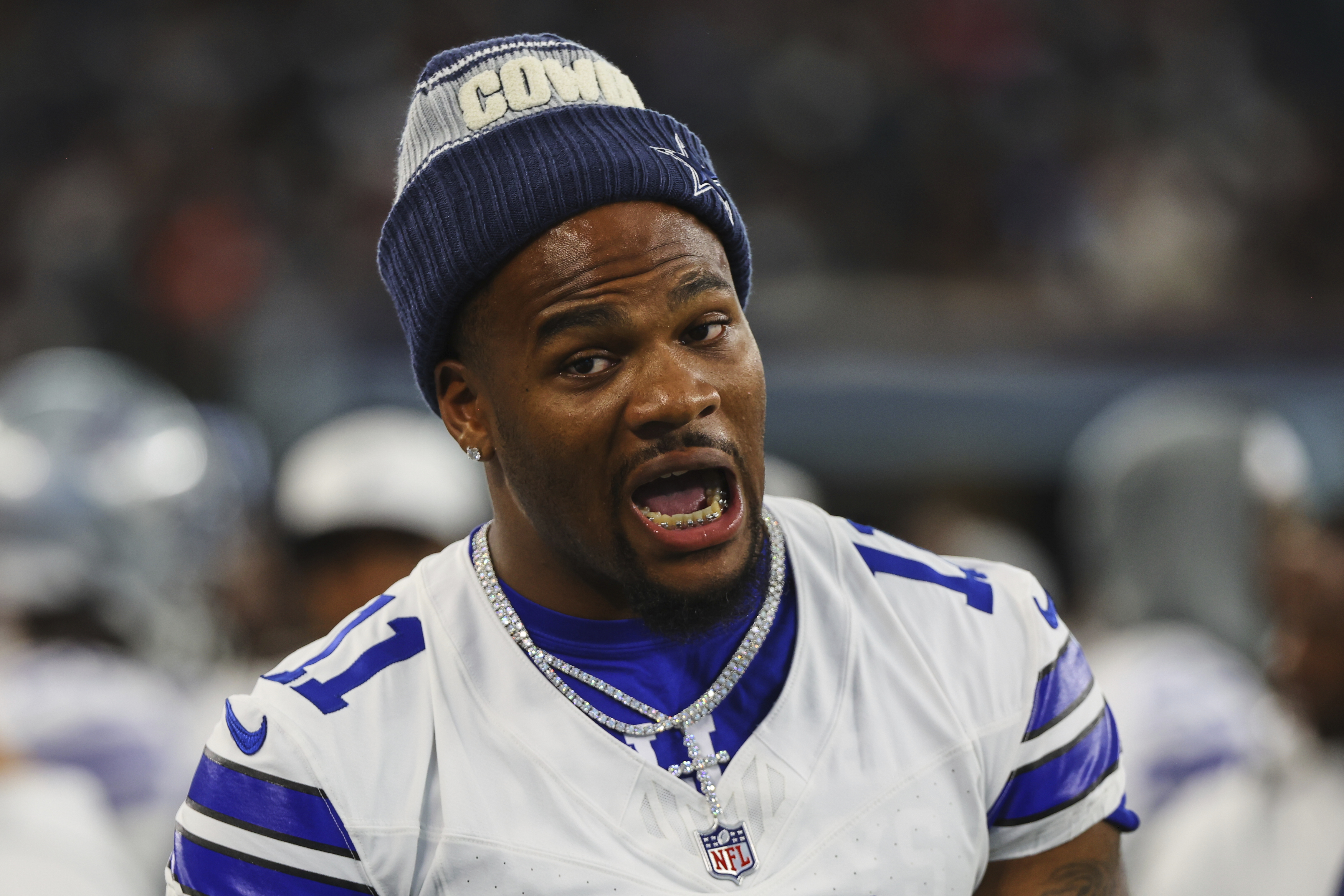 Dallas Cowboys' Micah Parsons talks with teammates on the sideline in the first half of a preseason NFL football game against the Baltimore Ravens Saturday, Aug. 16, 2025, in Arlington, Texas. 
