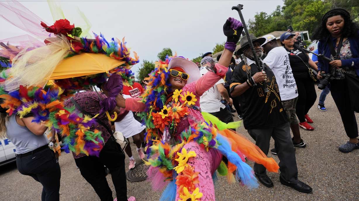 People form a second line parade during an event to commemorate the 20th anniversary of Hurricane Katrina, in the Lower 9th Ward of New Orleans, Friday.
