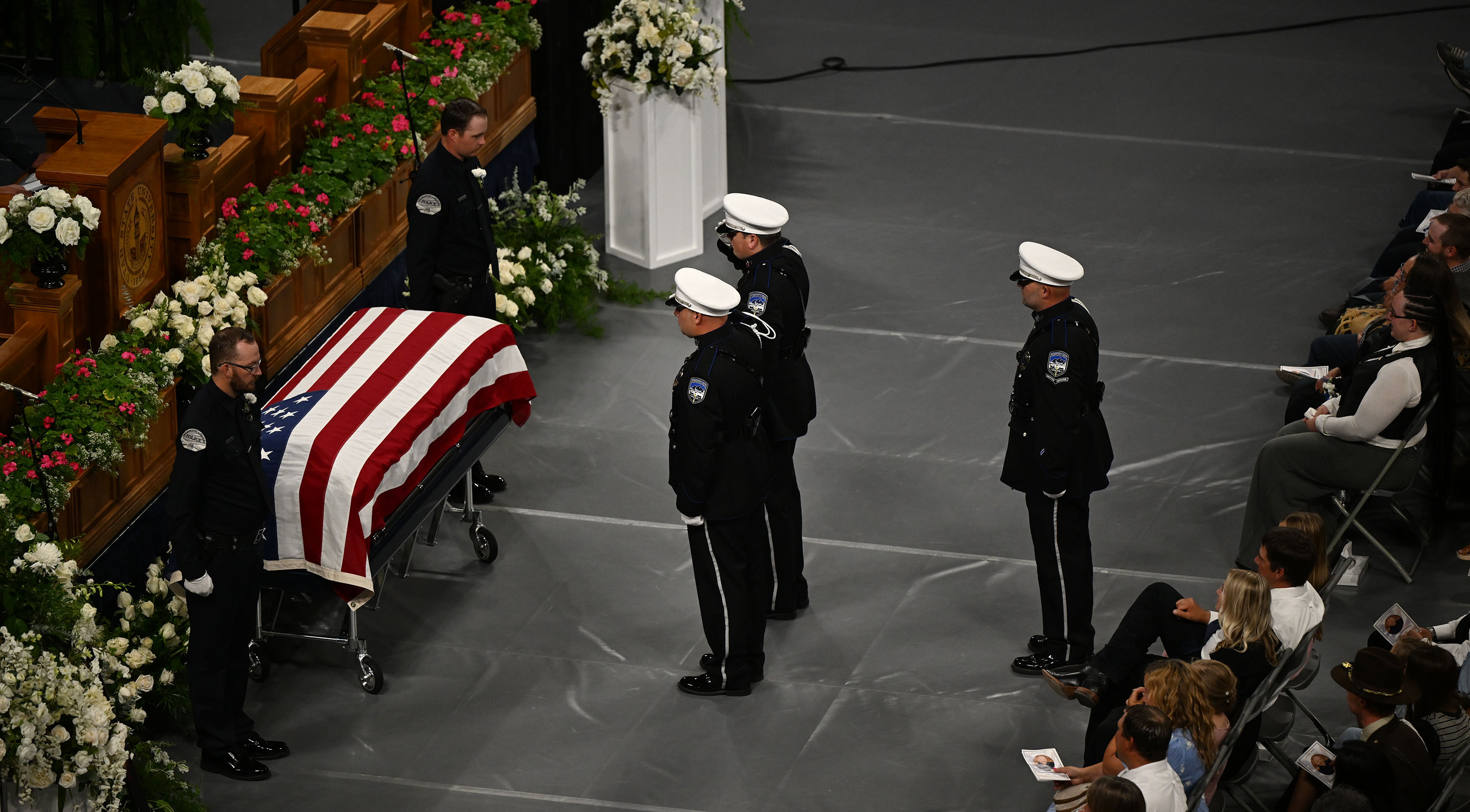 The casket of Tremonton-Garland Police Sgt. Lee Sorensen rests at the front of the stage in the Dee Glen Smith Spectrum during his funeral service in Logan on Friday.