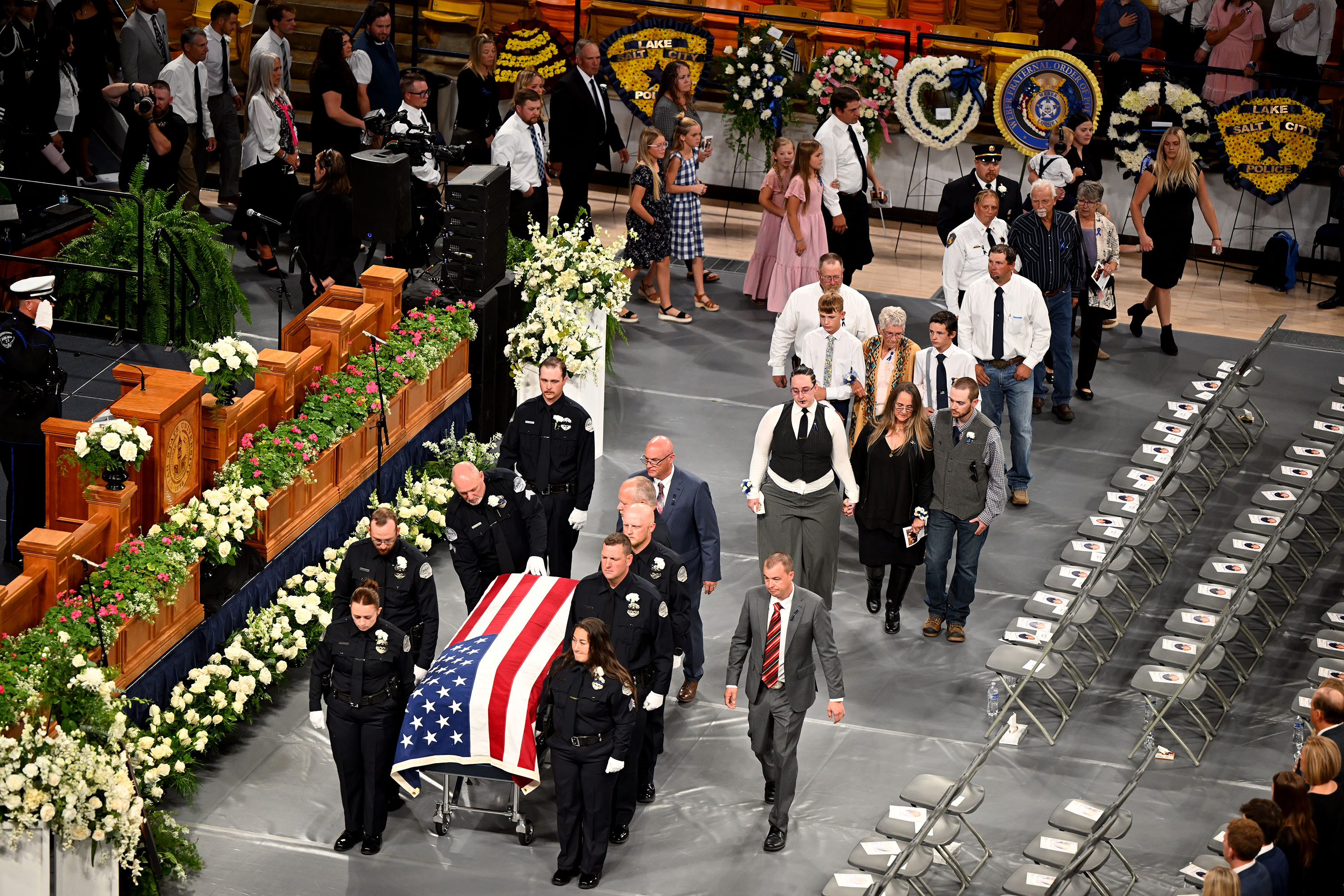 The casket of Tremonton-Garland Police Sgt. Lee Sorensen is brought into the Dee Glen Smith Spectrum during his funeral service in Logan on Friday.
