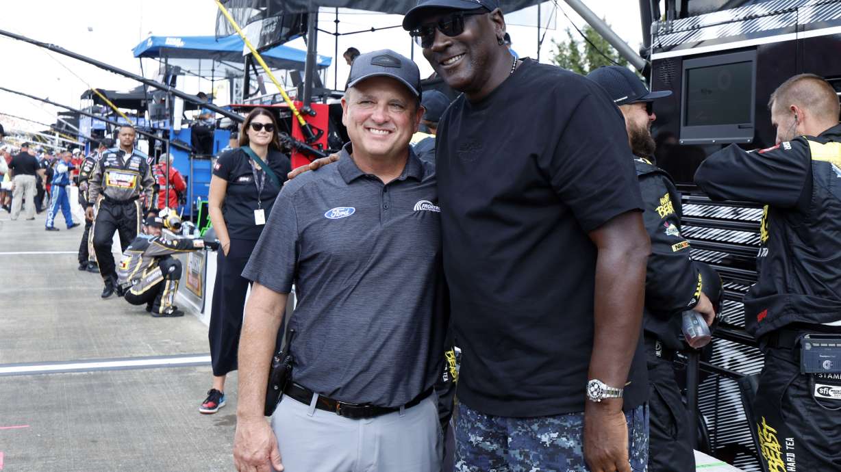 FILE - Bob Jenkins, owner of Front Row Motorsports and Co-Owner Michael Jordan, of 23XI Racing, pose before a NASCAR Cup Series auto race at Talladega Superspeedway, Oct. 6, 2024, in Talladega, Ala.