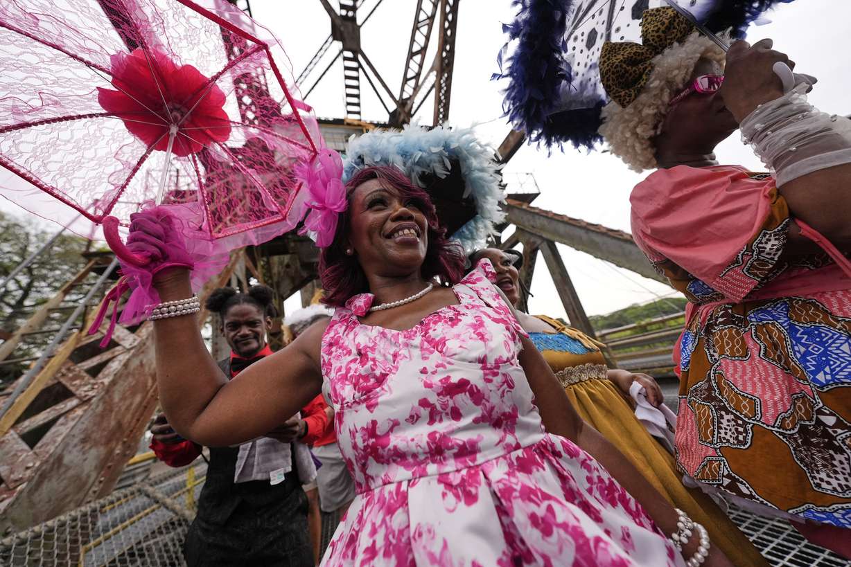 Members of the Original New Orleans Baby Dolls march in a second-line parade to commemorate the 20th anniversary of Hurricane Katrina, in the Lower 9th Ward of New Orleans, Friday. Parades like these are staples of every large-scale New Orleans event.
