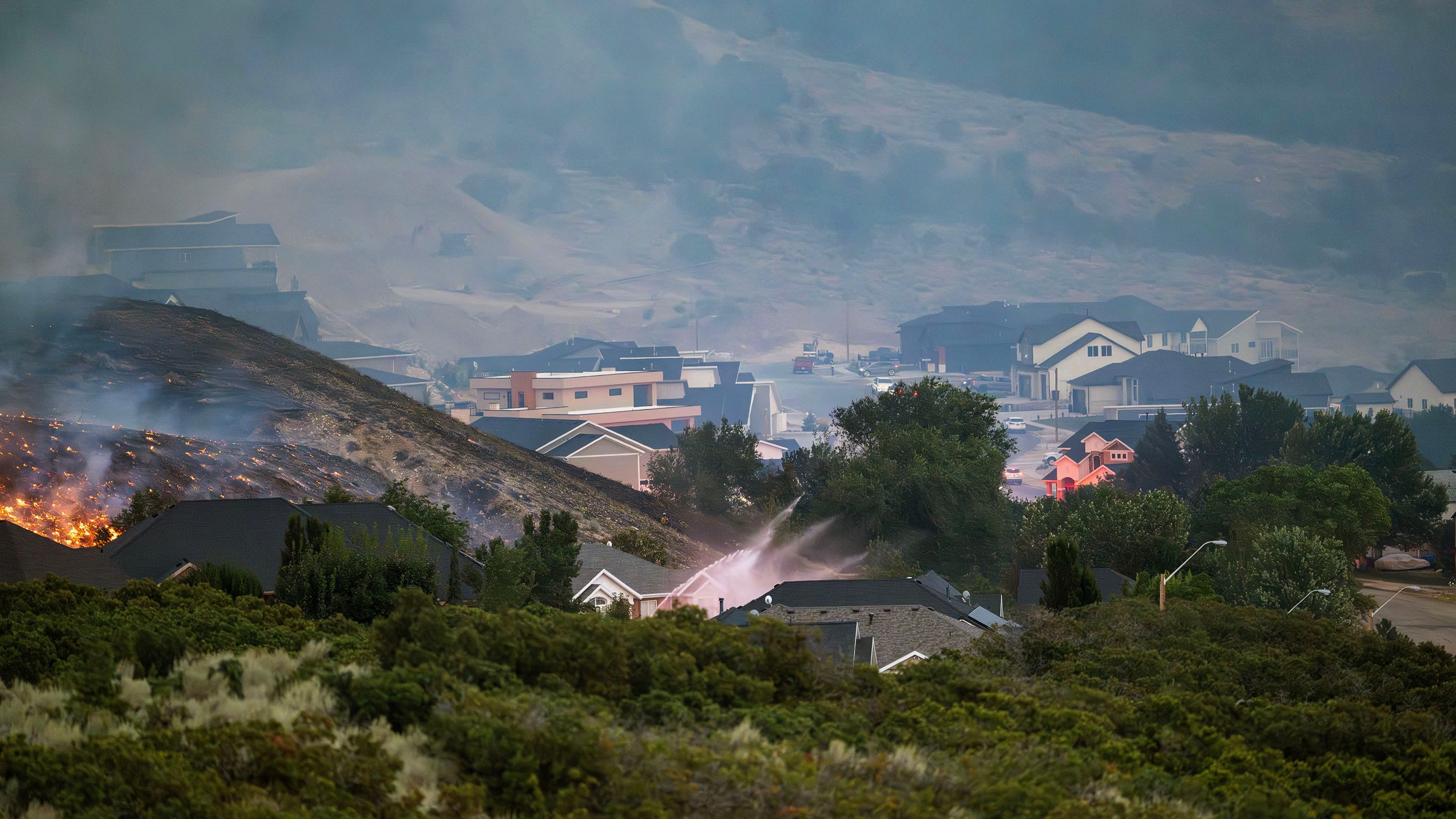 The Willard Peak fire underscores the fire risks in North Ogden mountain neighborhoods. The Aug. 13 photo shows firefighting efforts during the Willard Peak blaze.