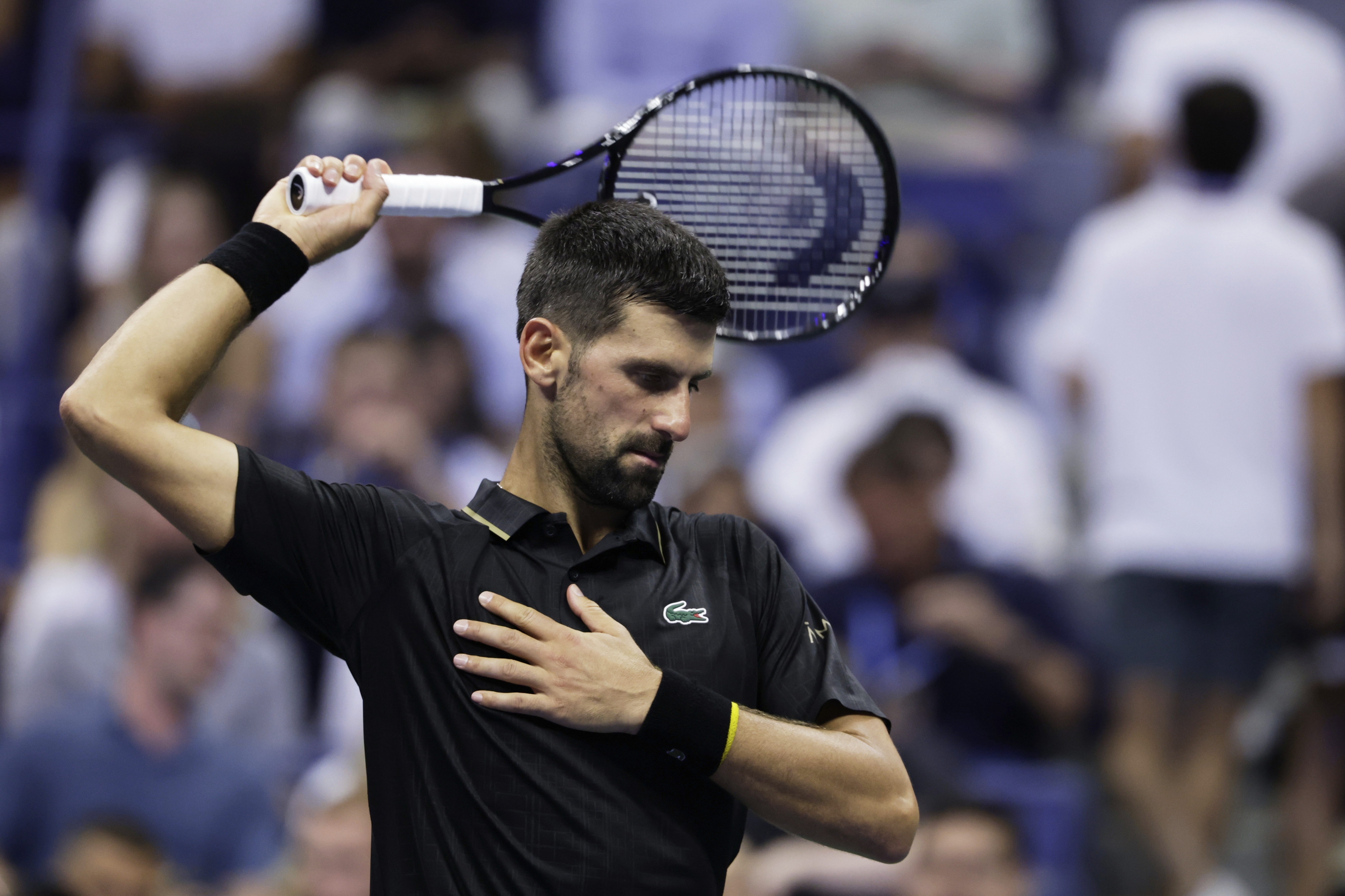 Novak Djokovic, of Serbia, stretches against Cameron Norrie, of Great Britain, during the third round of the U.S . Open tennis championships, Friday, Aug. 29, 2025, in New York. 