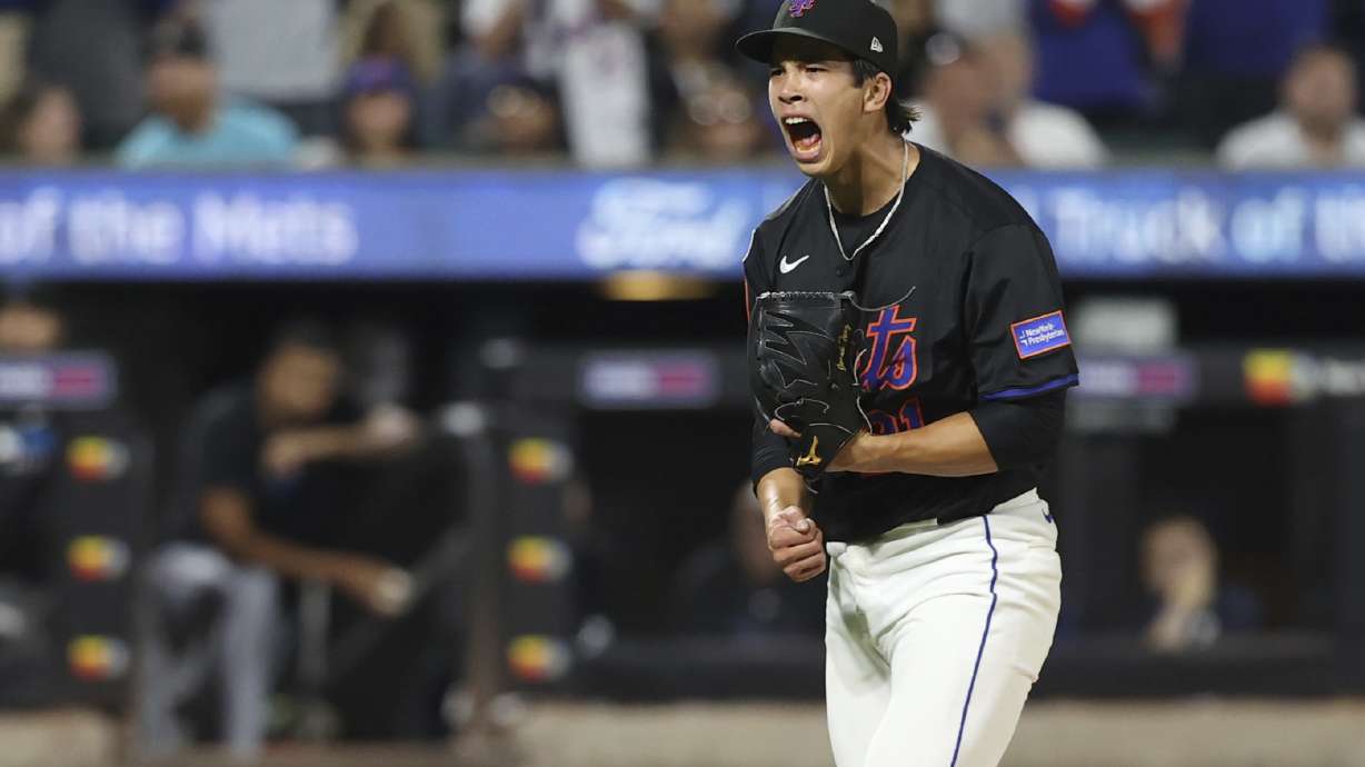 New York Mets pitcher Jonah Tong reacts after striking out Miami Marlins' Liam Hicks during the fifth inning of a baseball game Friday, Aug. 29, 2025, in New York.