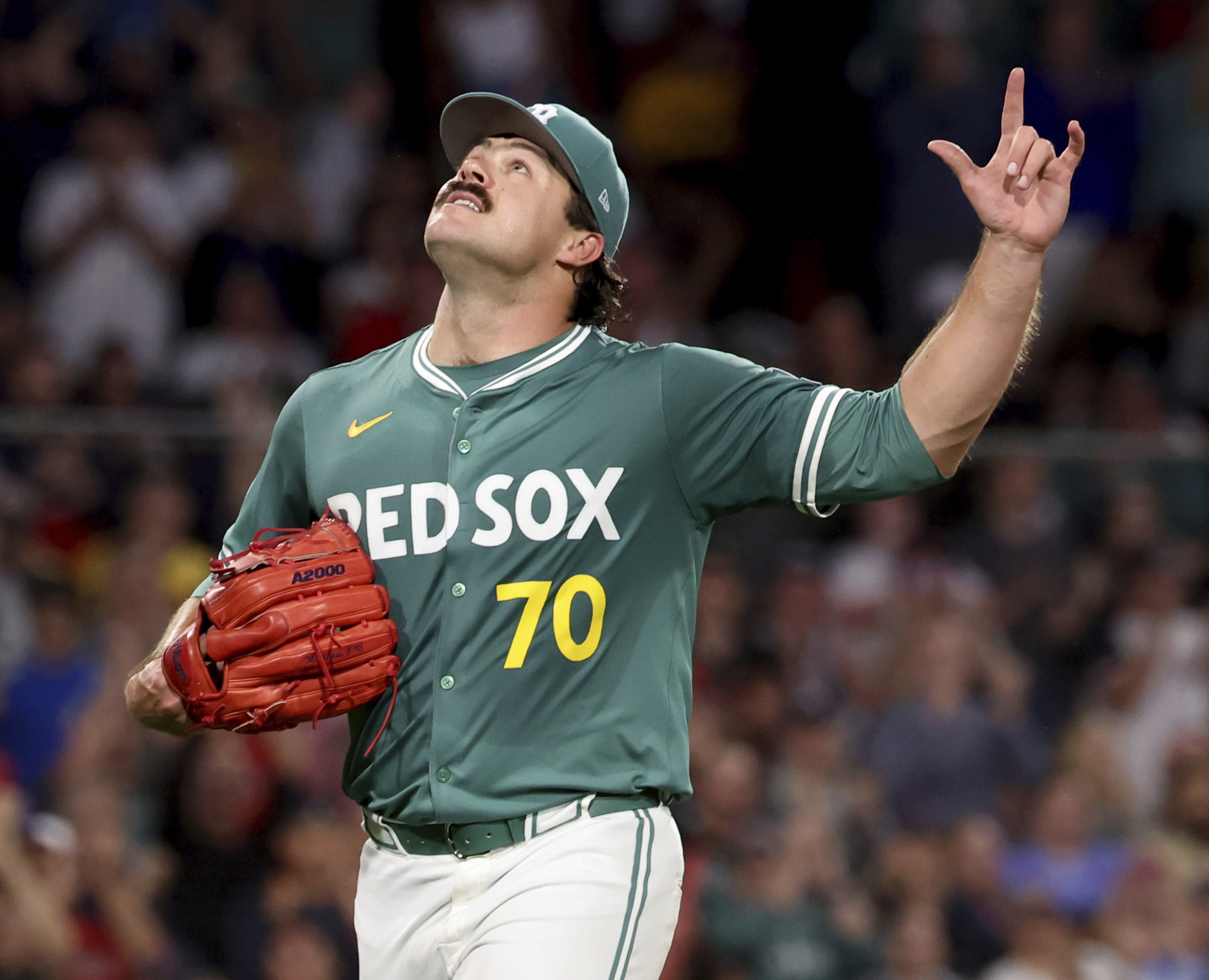 Boston Red Sox pitcher Payton Tolle gestures to the sky while walking to the dugout after being pulled during the sixth inning of a baseball game against the Pittsburgh Pirates, Friday, Aug. 29, 2025, in Boston. 