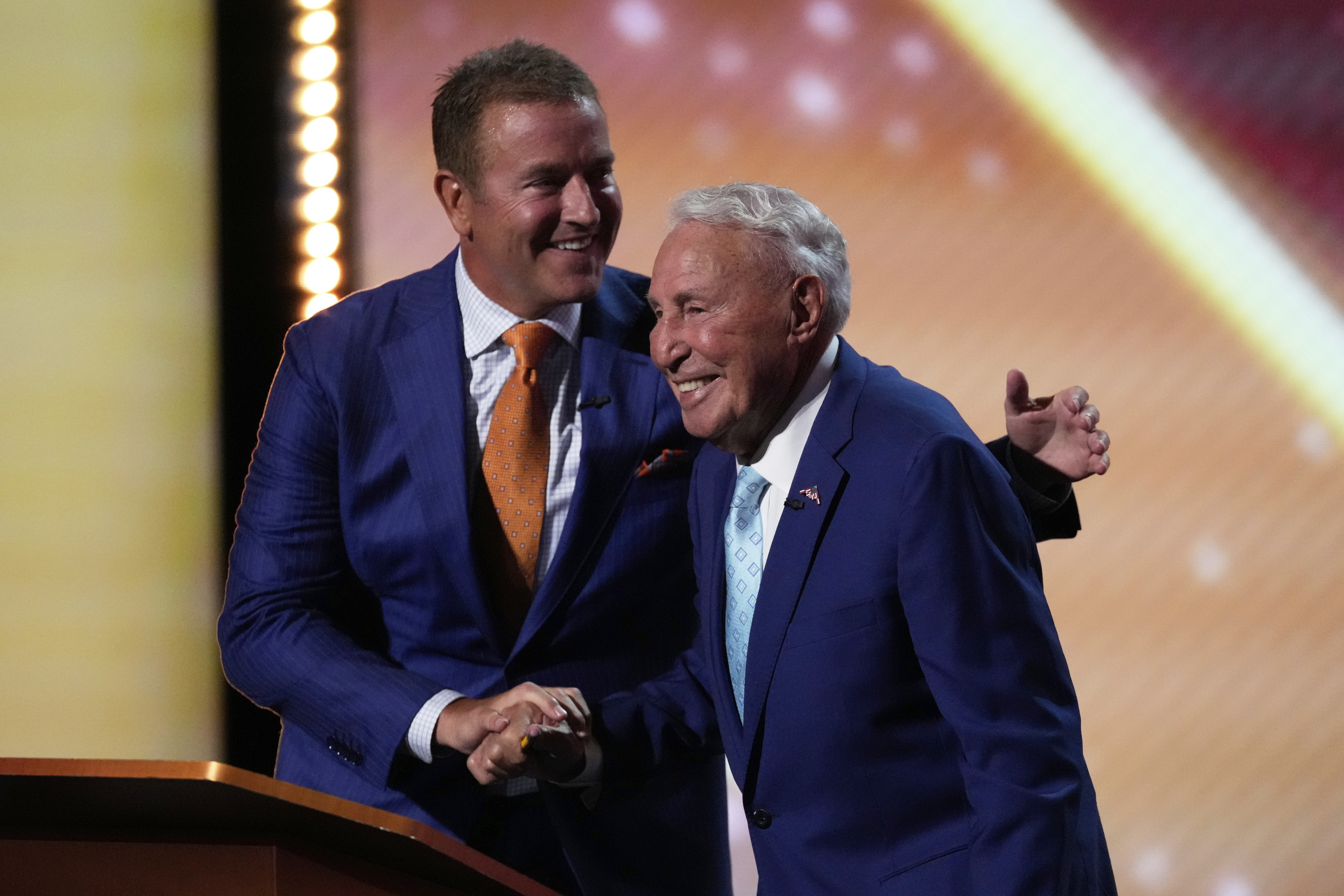 FILE - Kirk Herbstreit, left, greets Lee Corso on stage at the ESPY Awards at the Dolby Theatre in Los Angeles, July 16, 2025. 