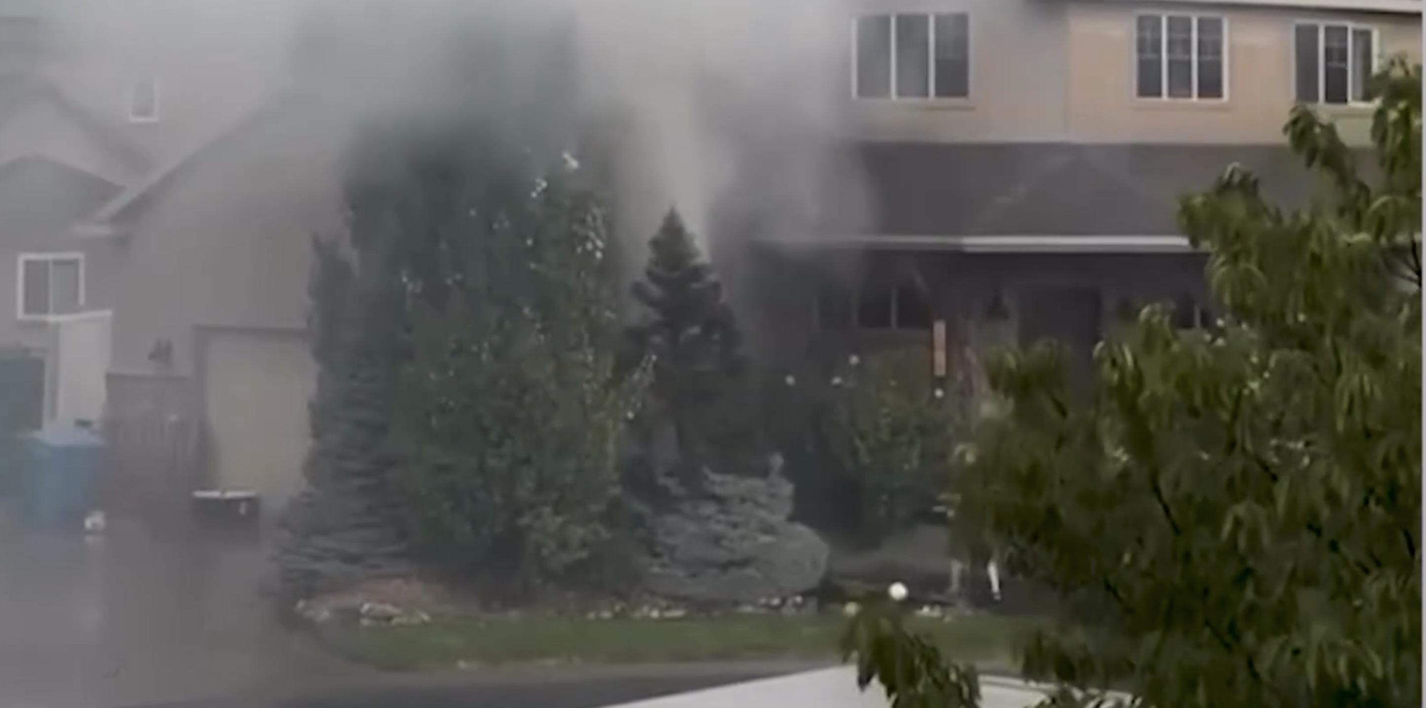 Neighbors spring into action after Cedar Hills lightning strikes tree, catches it on fire