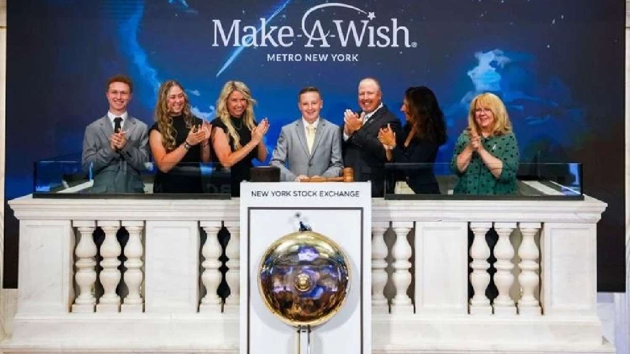 Cade Hulet rings the opening bell at the New York Stock Exchange, Aug. 18. Hulet and his family received the opportunity to ring the bell thanks to Make-A-Wish.