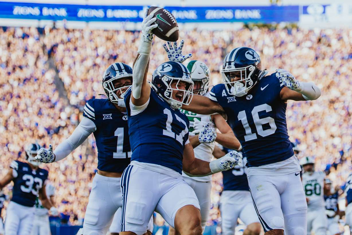 BYU's Jack Kelly celebrates a 62-yard scoop-and-score touchdown during the first half of an NCAA college football game, Saturday, Aug. 30, 2025 at LaVell Edwards Stadium in Provo, Utah.