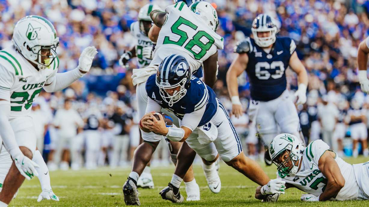 BYU's Bear Bachmeier scores one of two rushing touchdowns during the first half of an NCAA college football game, Saturday, Aug. 30, 2025 at LaVell Edwards Stadium in Provo, Utah.