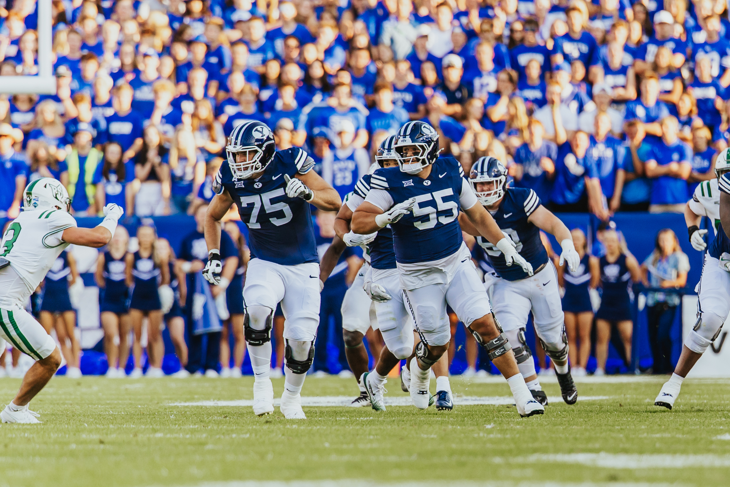 BYU's Andrew Genty and Austin Leausa block downfield during the first half of an NCAA college football game, Saturday, Aug. 30, 2025 at LaVell Edwards Stadium in Provo, Utah.