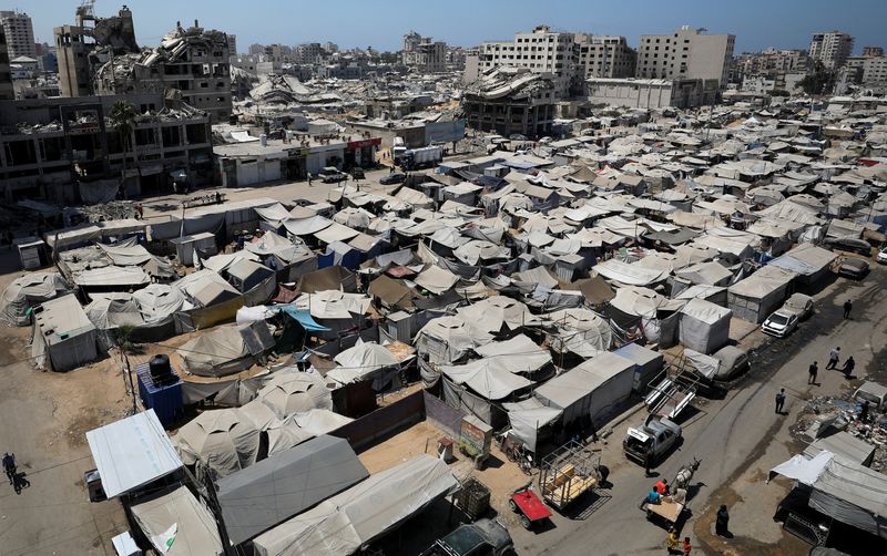 Tents shelter Palestinians displaced by the Israeli military offensive, in Gaza City, August 23.