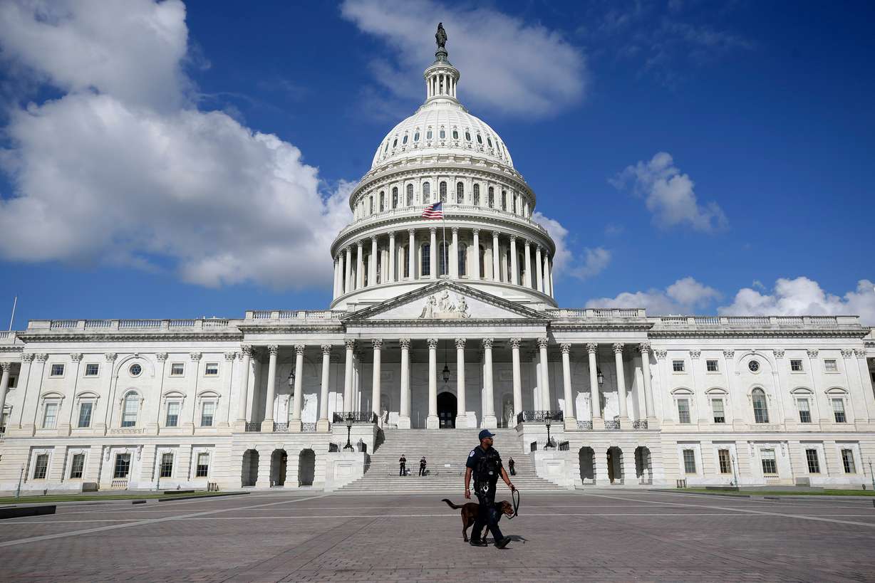 A U.S. Capitol Police officer in front of the Capitol, Aug. 22, in Washington. The killing of Charlie Kirk has lawmakers reconsidering their personal security.