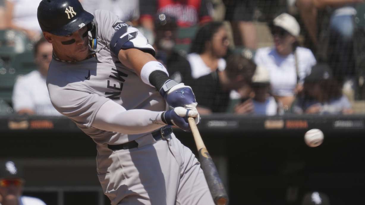 New York Yankees' Aaron Judge hits a solo home run during the first inning of a baseball game against the Chicago White Sox in Chicago, Sunday, Aug. 31, 2025.