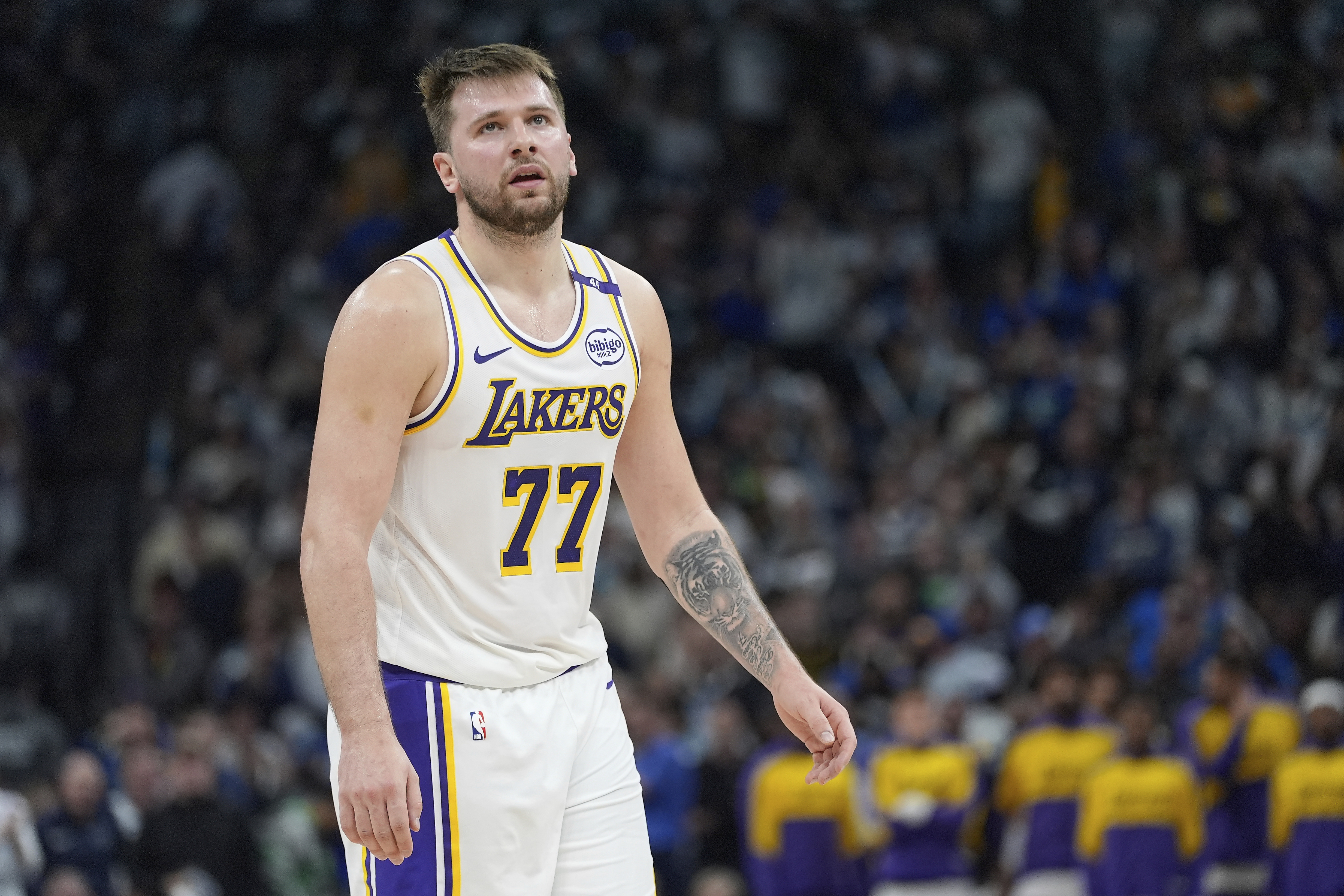 FILE - Los Angeles Lakers guard Luka Doncic (77) reacts after a foul called on the Lakers during the first half of Game 4 of an NBA basketball first-round playoff series against the Minnesota Timberwolves, Sunday, April 27, 2025, in Minneapolis.