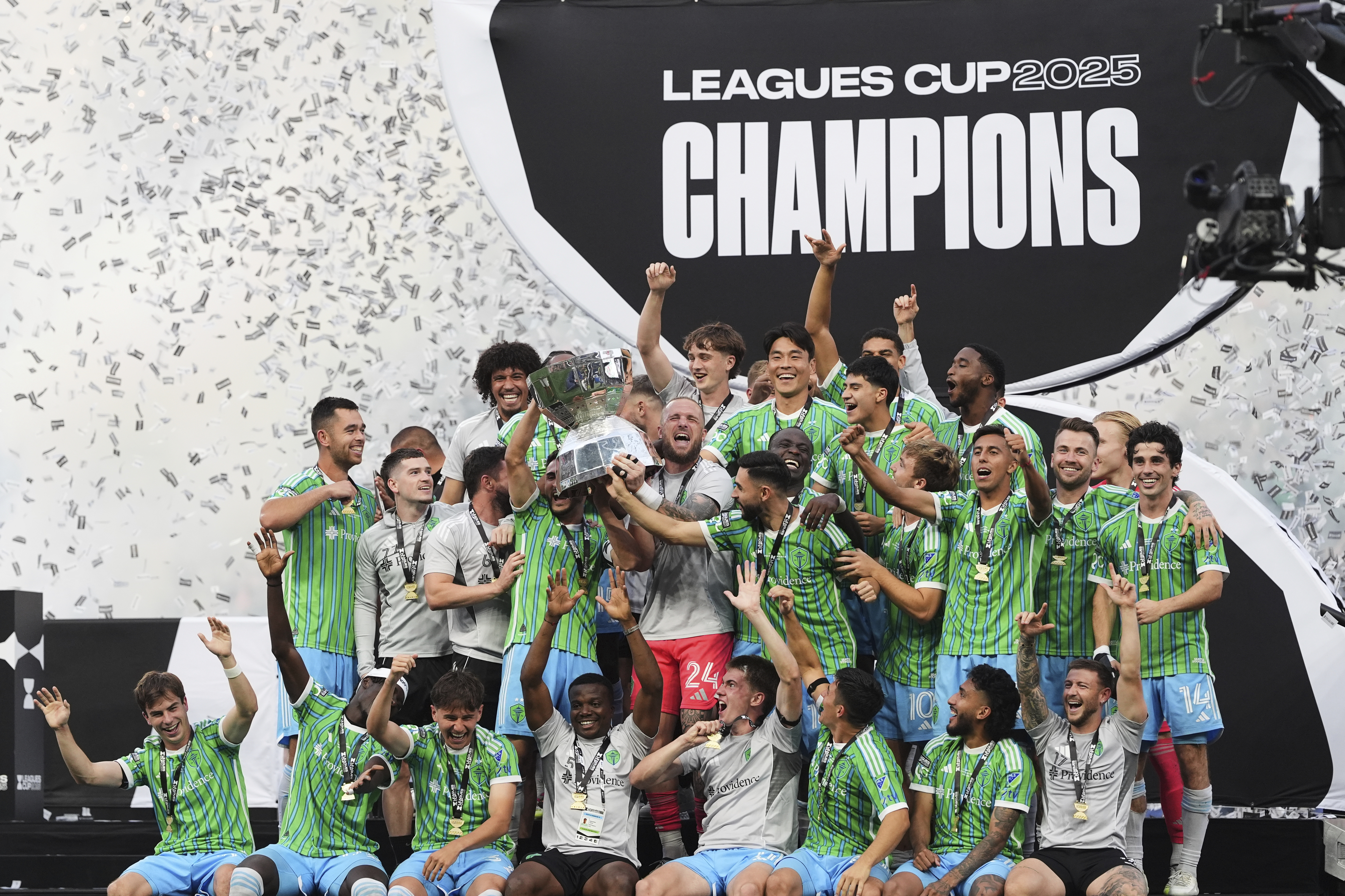 The Seattle Sounders lift the trophy as they celebrate beating Inter Miami in a Leagues Cup final soccer match Sunday, Aug. 31, 2025, in Seattle. 