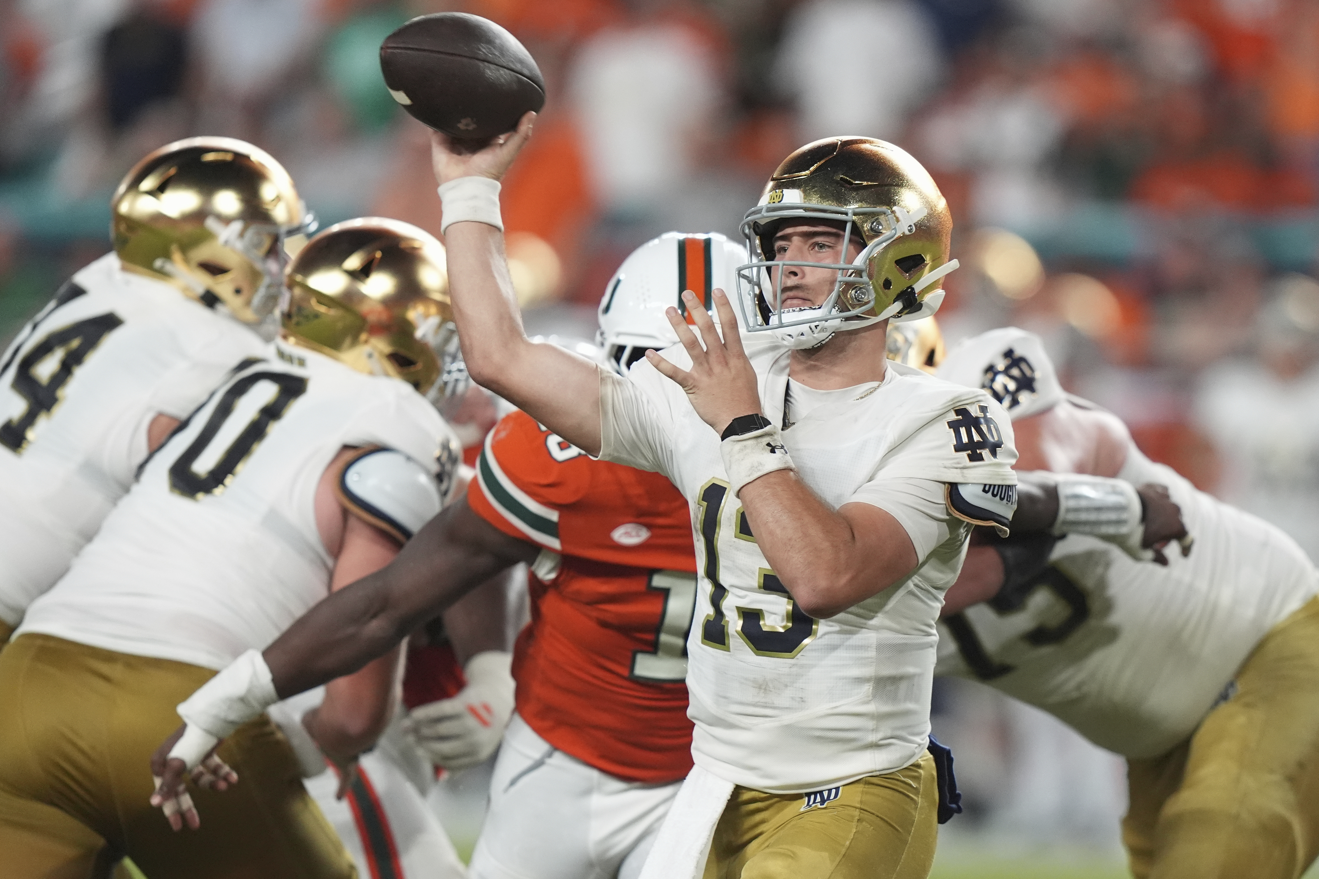 Notre Dame quarterback CJ Carr (13) throws during the second half of an NCAA college football game against Miami, Sunday, Aug. 31, 2025, in Miami Gardens, Fla. 