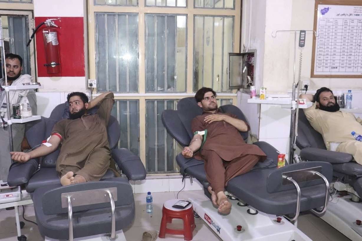 In this photo released by the Ministry of Public Health, Afghans donate blood for victims of an earthquake that killed hundreds and destroyed numerous villages in eastern Afghanistan, at Nangarhar Regional Hospital on Monday.