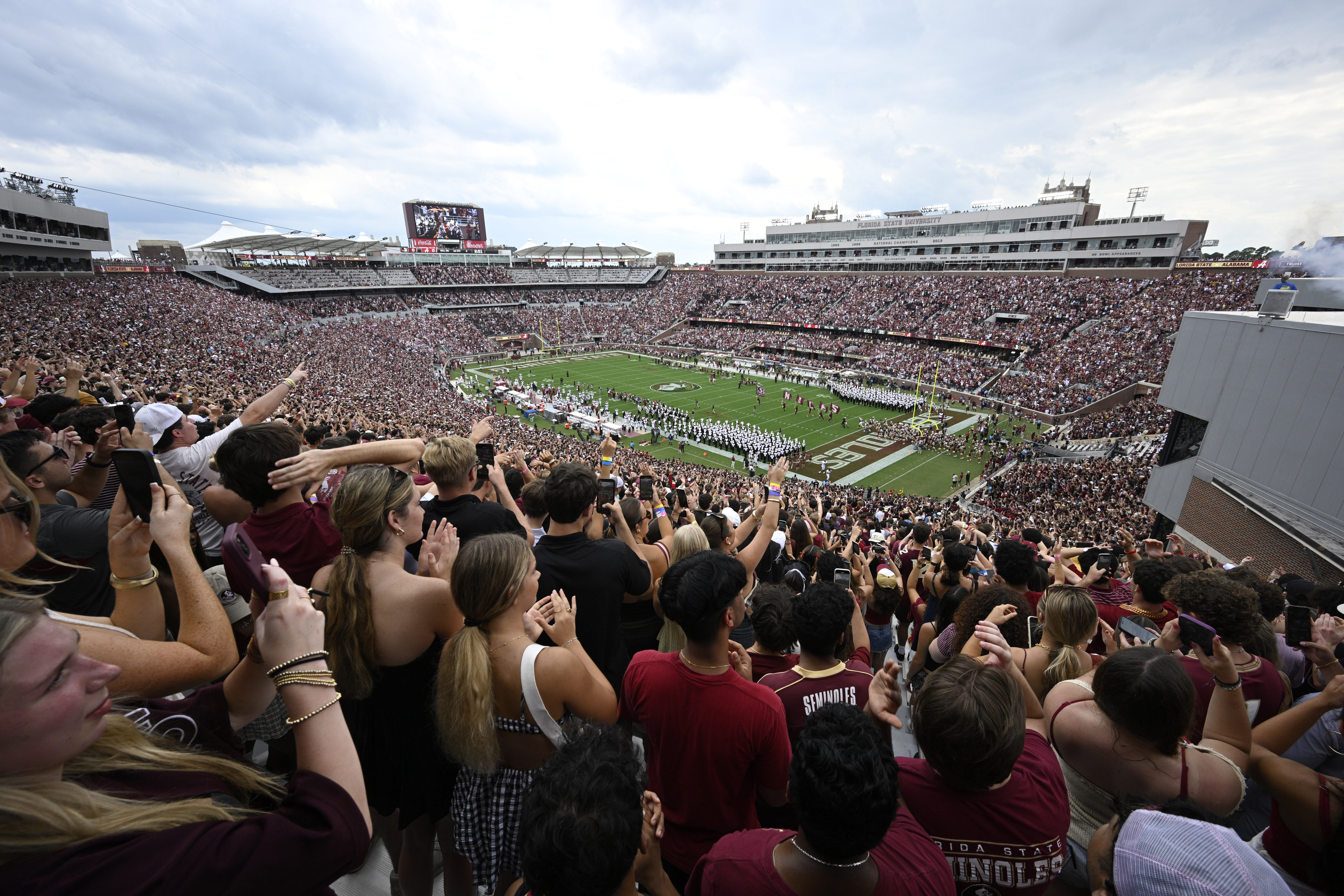 Florida State players run onto the field before the start of an NCAA college football game against Alabama, Saturday, Aug. 30, 2025, in Tallahassee, Fla. 