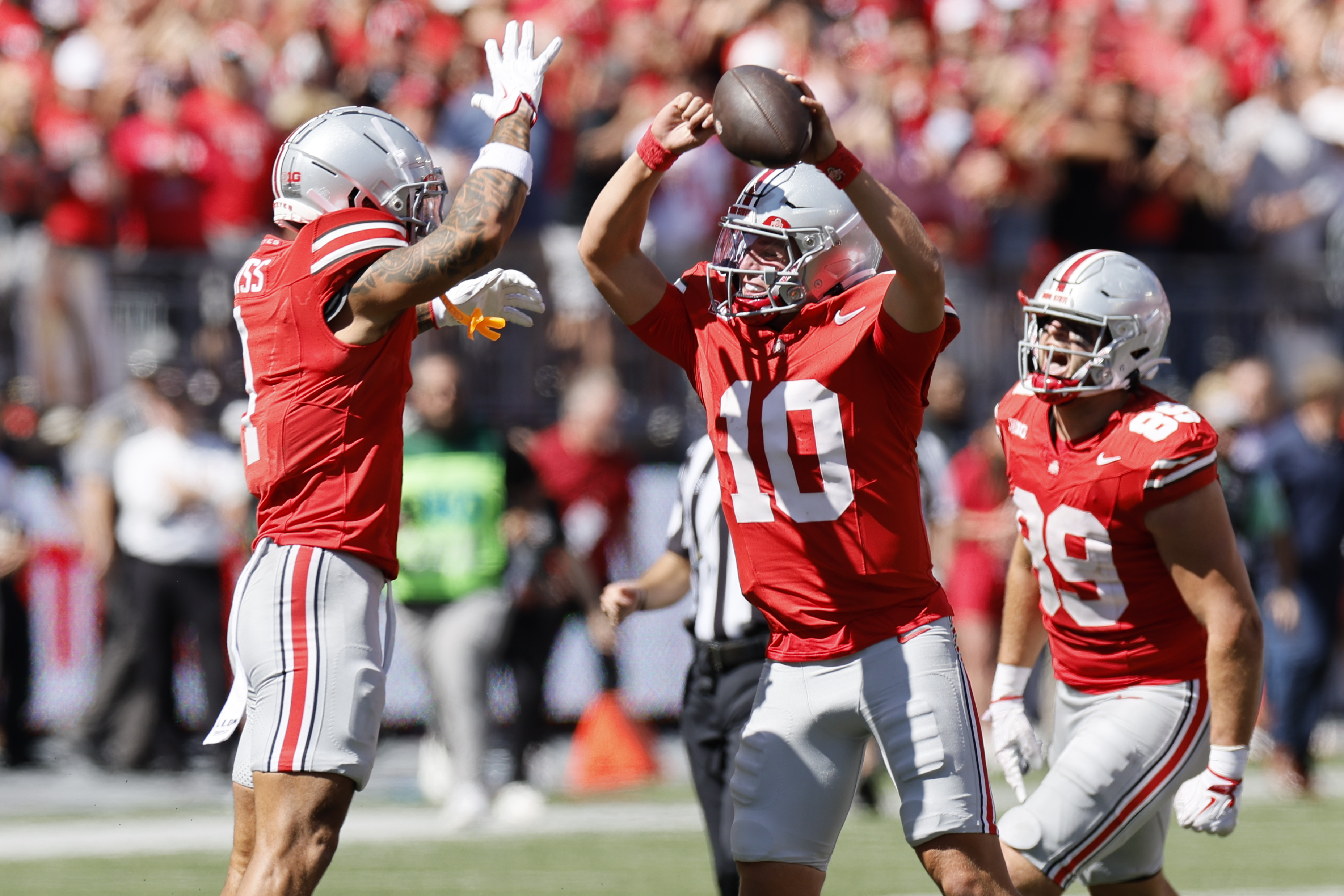 Ohio State receiver Brandon Inniss, left and quarterback Julian Sayin celebrate their win over Texas following an NCAA college football game, Saturday, Aug. 30, 2025, in Columbus, Ohio. 